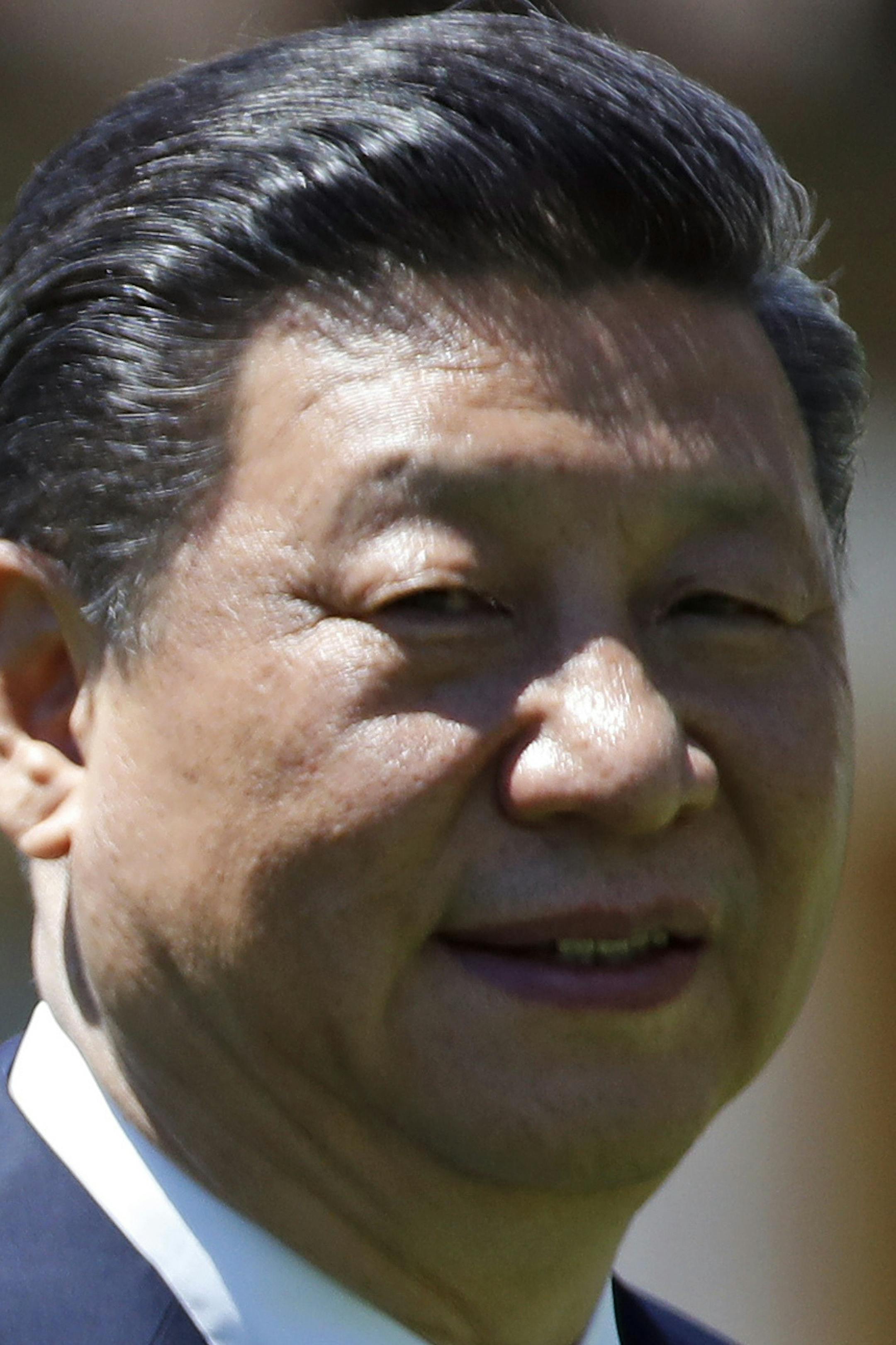 President Donald Trump and Chinese President Xi Jinping walk together after their meetings at Mar-a-Lago, Friday, April 7, 2017, in Palm Beach, Fla. Trump was meeting again with his Chinese counterpart Friday, with U.S. missile strikes on Syria adding weight to his threat to act unilaterally against the nuclear weapons program of China's ally, North Korea. (AP Photo/Alex Brandon)
