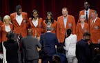 Members of the 2020 Basketball Hall of Fame class pose for a photo on stage in their Hall of Fame jackets after a tip-off celebration and awards gala,