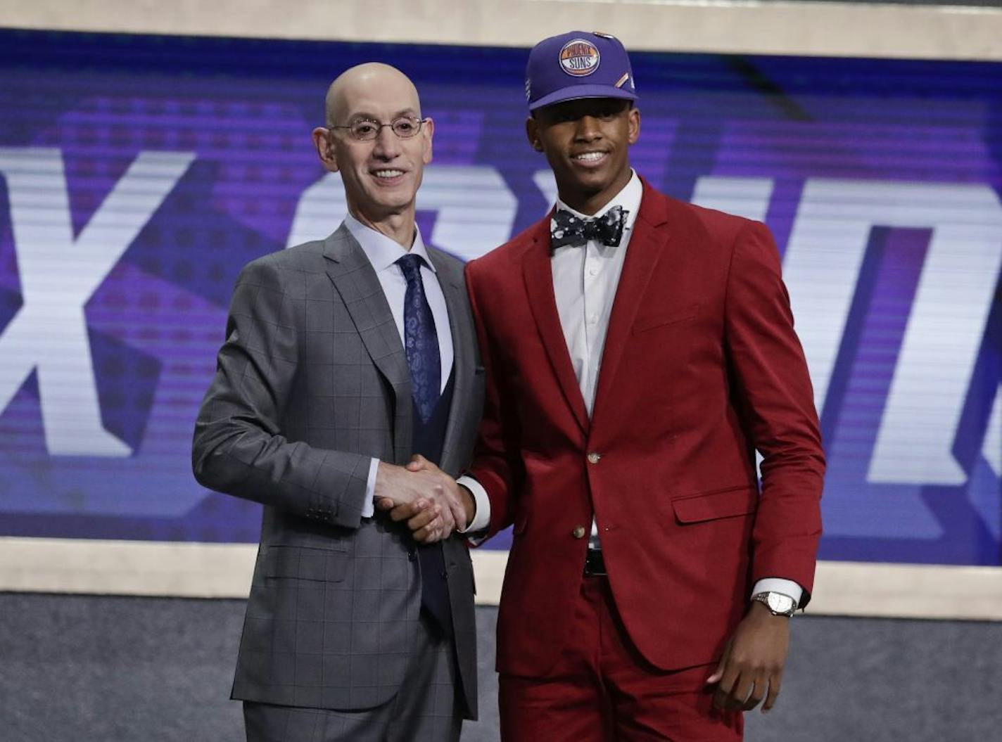 NBA Commissioner Adam Silver poses for photographs with Texas Tech's Jarrett Culver.