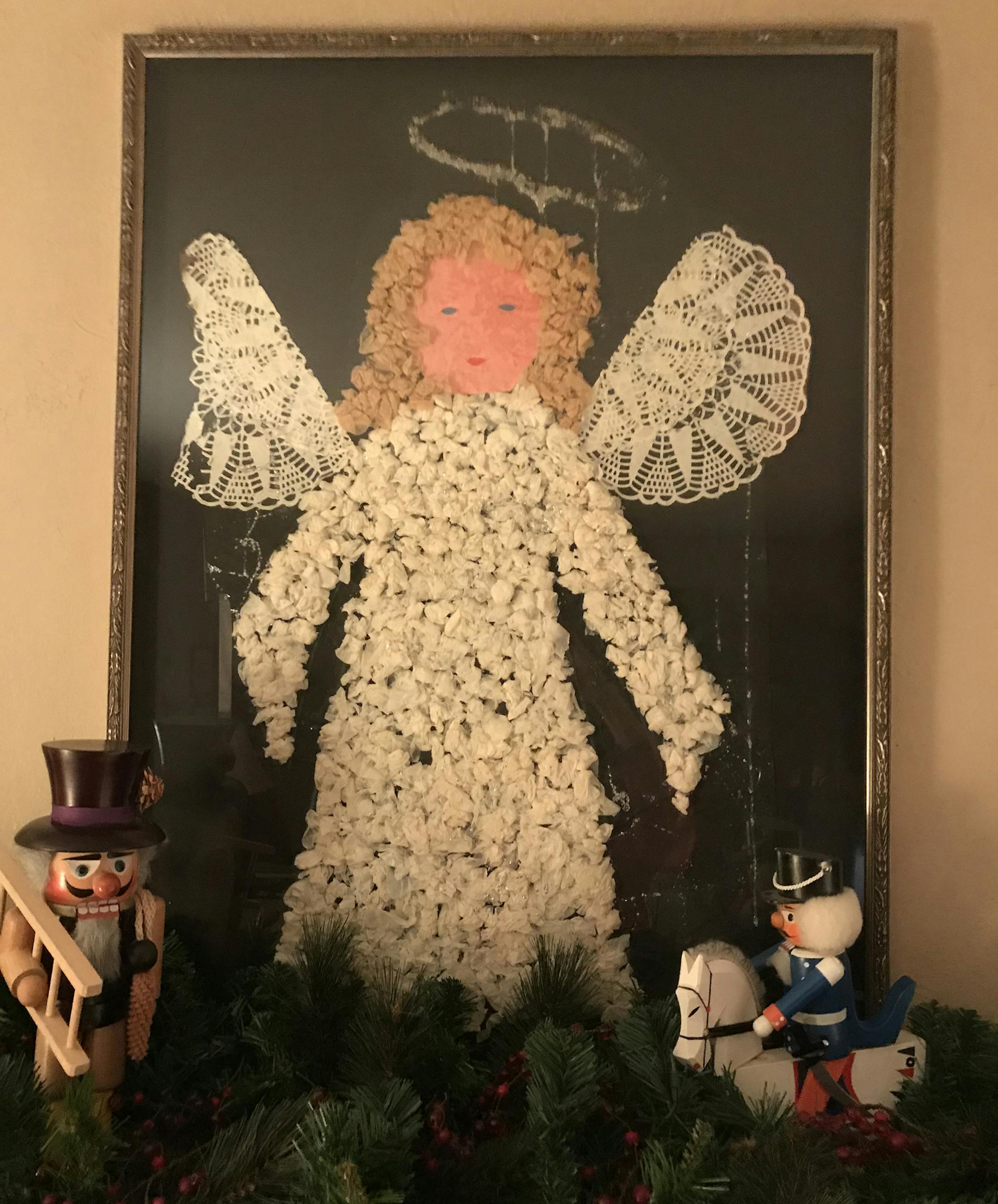 Kate Costello, St. Paul
My family was living on a tiny air base in rural England in the early 1980s. I went to pre-school at the local Church of England primary school. We made this angel poster as a class project one year around Christmas time, and I won it in a raffle at the end of term holiday party. It certainly wasn't put together with durability or longevity in mind. You can tell from the glitter drool that drips from the halo, not to mention the glue damage that has seeped through the pin