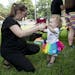 Catherine Diamond dances with her daughter Layla at the pride festival on Saturday.