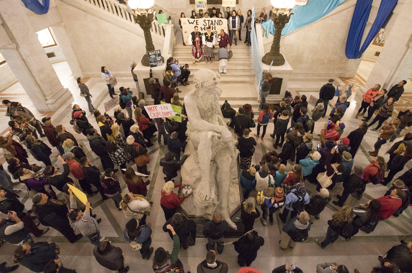 Protesters gather inside city hall in Minneapolis during a Dakota Access Pipeline rally. ] (Leila Navidi/Star Tribune) leila.navidi@startribune.com BACKGROUND INFORMATION: People rally against deputies from the Hennepin County Sheriff's Office being sent to the pipeline protests in North Dakota outside of City Hall in Minneapolis on Tuesday, October 25, 2016. After the State of North Dakota requested assistance, deputies from Hennepin, Anoka and Washington County sheriff's offices were deployed