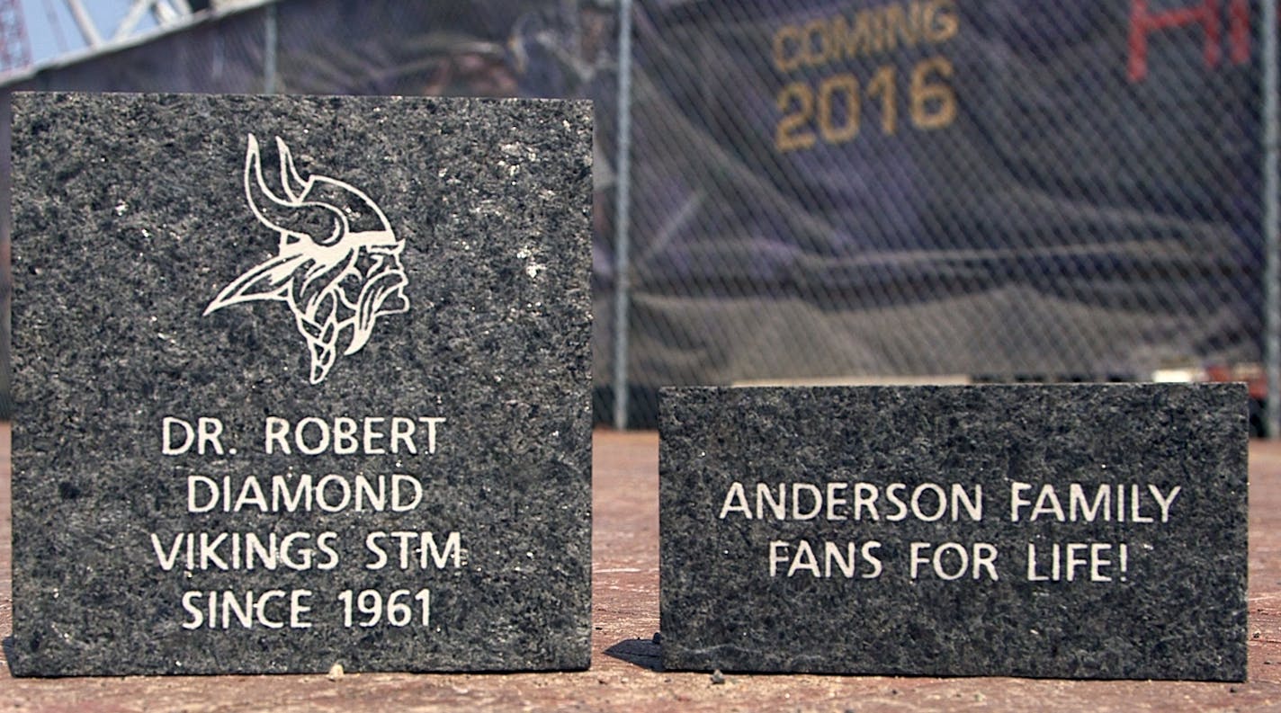 Two samples of engraved bricks are shown outside the new Vikings stadium construction area. The team is selling the bricks to the public in pairs for prices between $160 and $360. One brick will be mailed to the owner, and the other will permanently rest on the western plaza of the new stadium. ] SHARI L. GROSS sgross@startribune.com Two sample engraved bricks are shown in front of the new Vikings stadium in Minneapols, May 27, 2015.