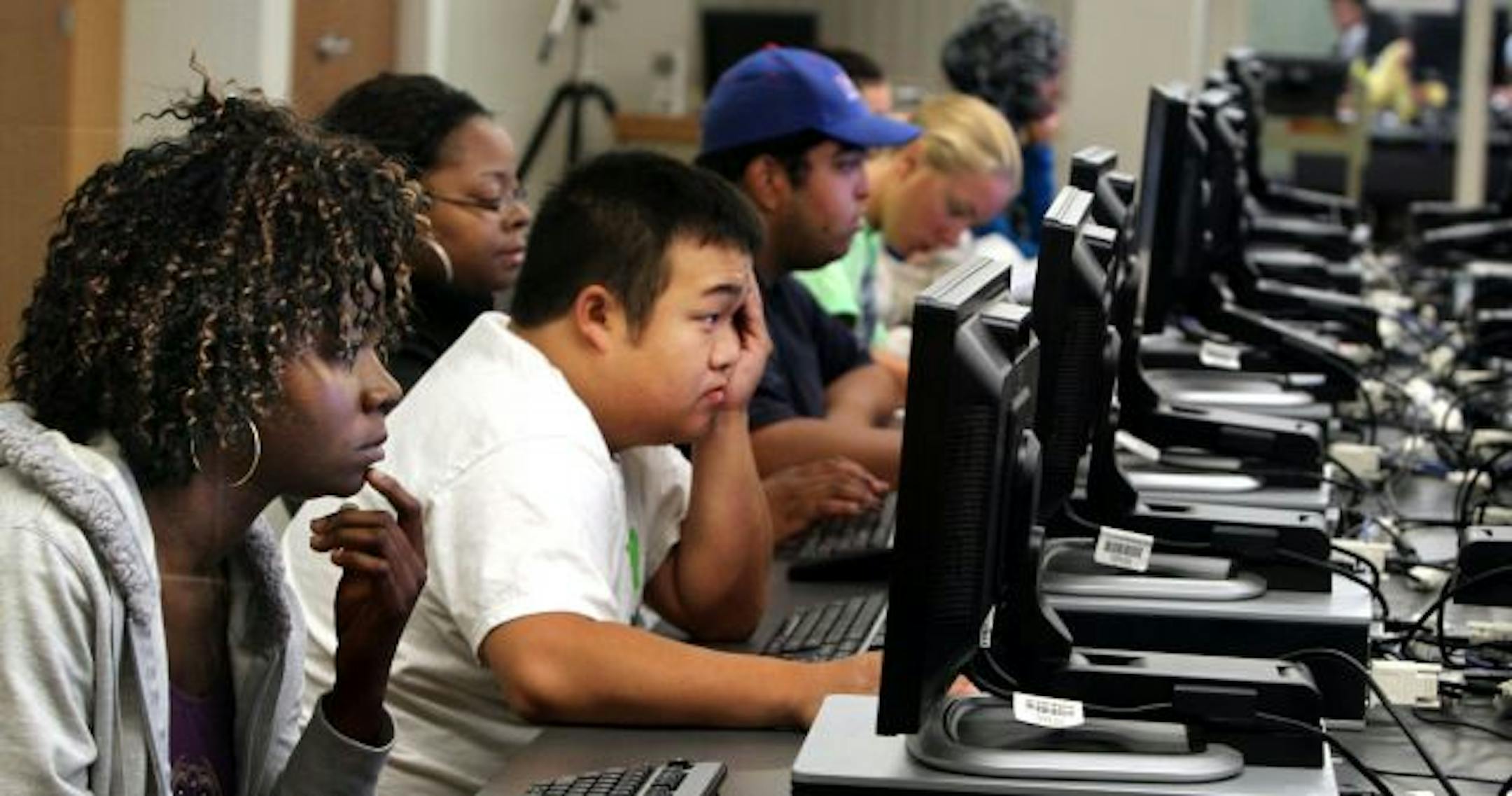 Students pack the open computer lab, including Catherine Karnuah, originally from Liberia but now living in New Brighton, front to back, and Jeff Kong of North St. Paul.