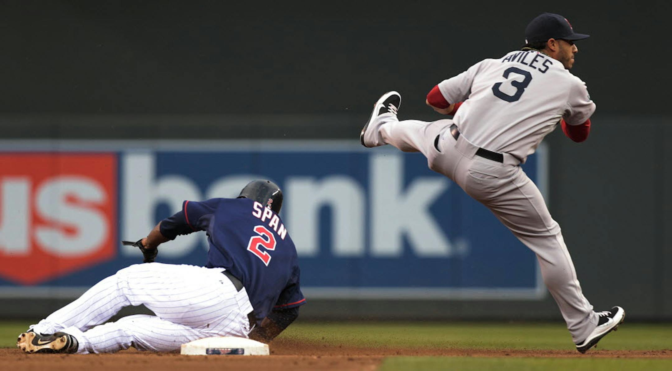 Boston shortstop Mike Aviles threw to first base on a double-play attempt, after forcing out Denard Span in the first inning Tuesday.
