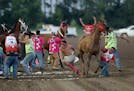 Riders make the first lap exchange during the first heat of the Indian Horse Relay.