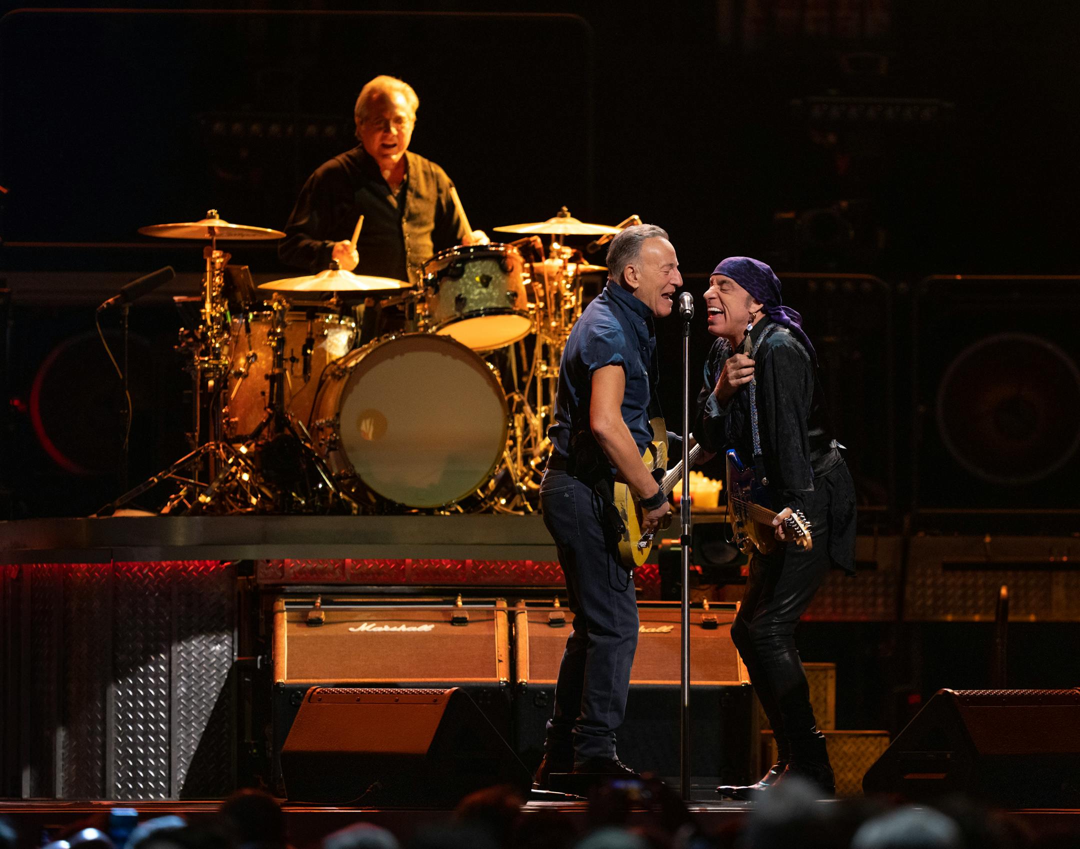 Bruce Springsteen with guitarist Steven Van Zandt and  drummer Max Weinberg early in their set.
