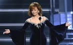 Host Reba McEntire speaks at the 53rd annual Academy of Country Music Awards at the MGM Grand Garden Arena on Sunday, April 15, 2018, in Las Vegas. (P