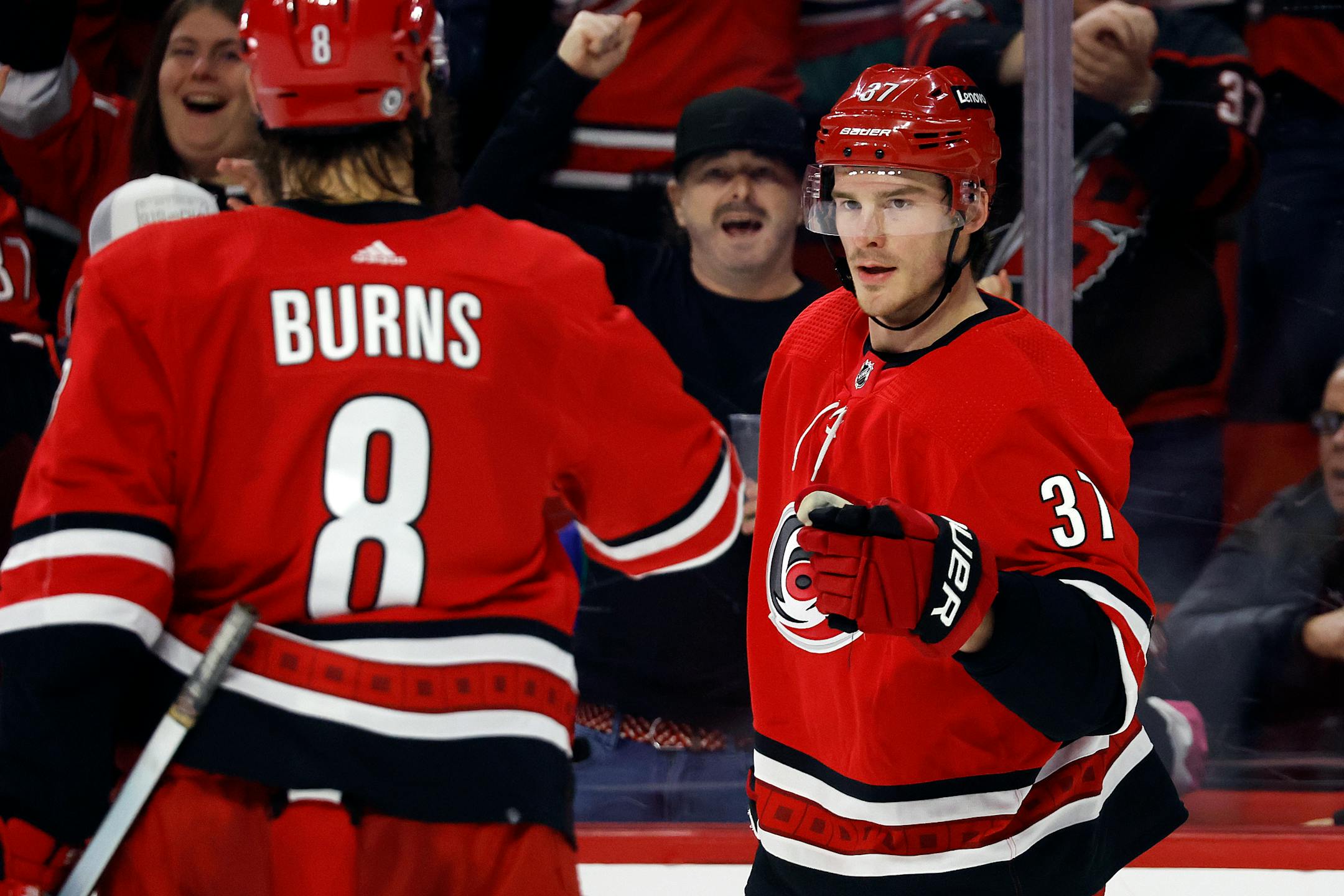 Carolina's Andrei Svechnikov was congratulated on his hat trick by teammate Brent Burns during the third period Thursday