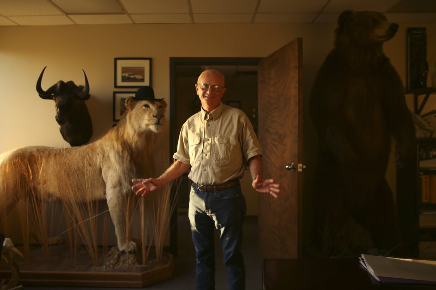 Jim Derhaag in his Shakopee office Wednesday evening with a lion and a black wildebeest he shot while on hunting safaris in Africa, along with a brown bear he shot in Russia. ] JEFF WHEELER &#x2022; jeff.wheeler@startribune.com Jim Derhaag, an avid big game hunter, was photographed with some of his trophies in his office Wednesday evening, July 29, 2015.