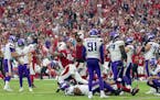 The Arizona Cardinals celebrated after Minnesota Vikings kicker Greg Joseph (1) missed a 37-yard field goal attempt on the final play of the game Sund