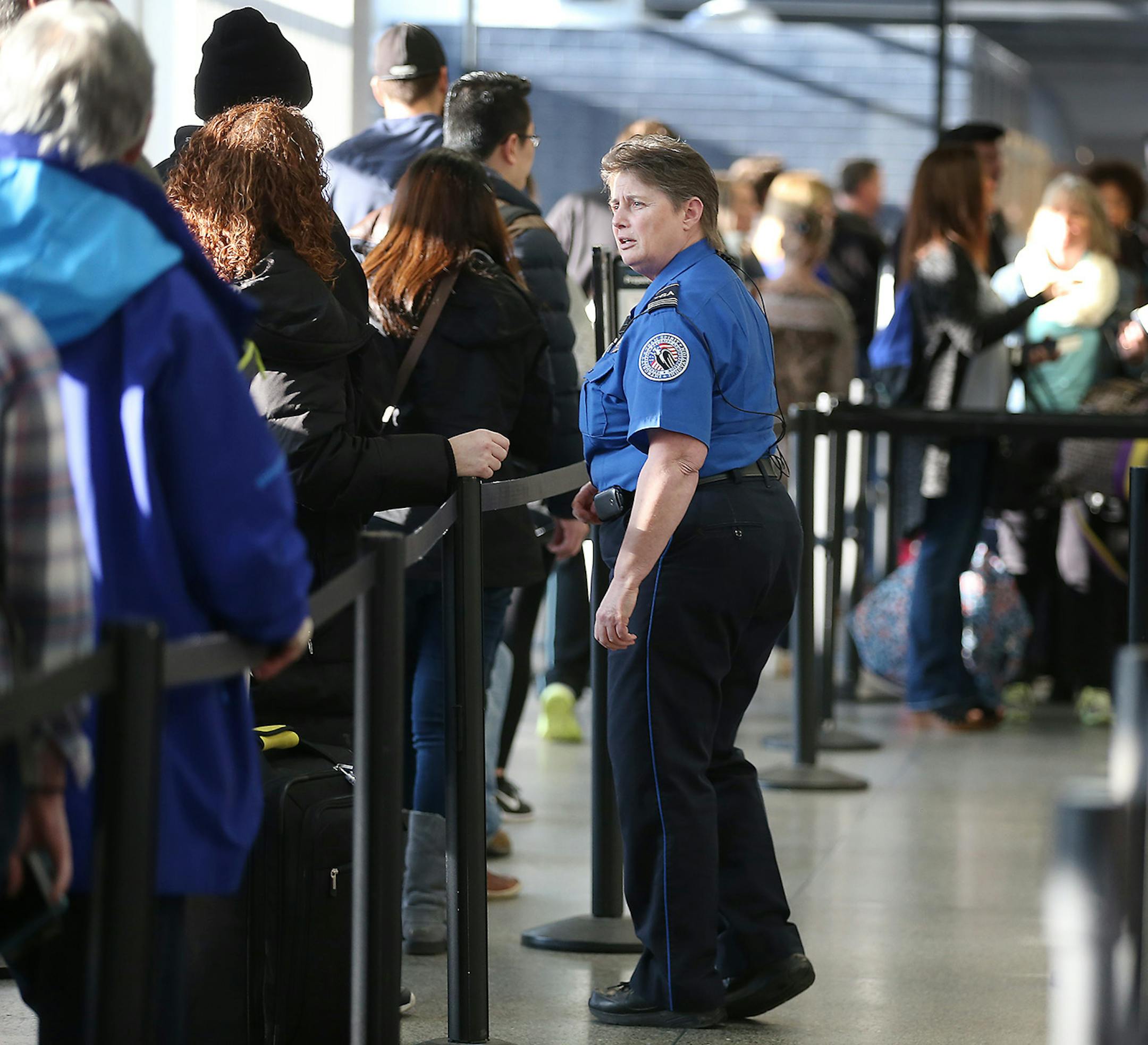 TSA security moved people through the security line at Terminal one at Minneapolis/St. Paul International Airport, Friday, March 11, 2016 in Bloomington, MN. ] (ELIZABETH FLORES/STAR TRIBUNE) ELIZABETH FLORES • eflores@startribune.com