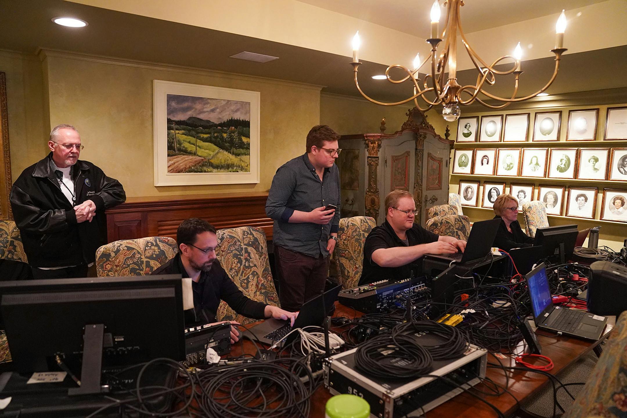 Press secretary Teddy Tschann, second from right, worked with the assembled crew in the basement of the residence, They were responsible for the live feed of the Governor's address.