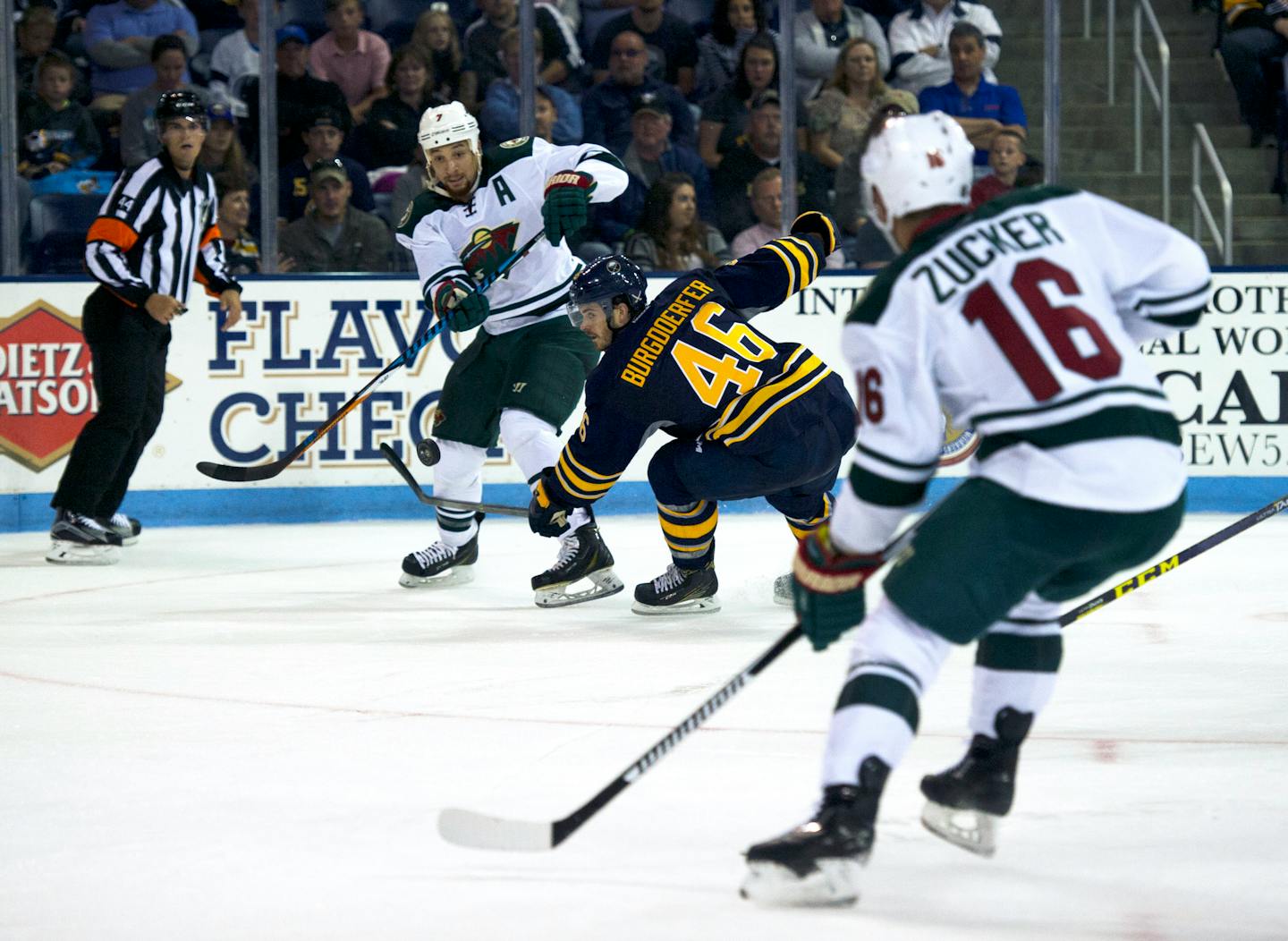 The Wild's Chris Stewart passed to Jason Zucker as the Sabres' Erik Burgdoerfer defended during an NHL exhibition game Monday in State College, Pa. Zucker's third-period power-play goal lifted the Wild over the Sabres 2-1.