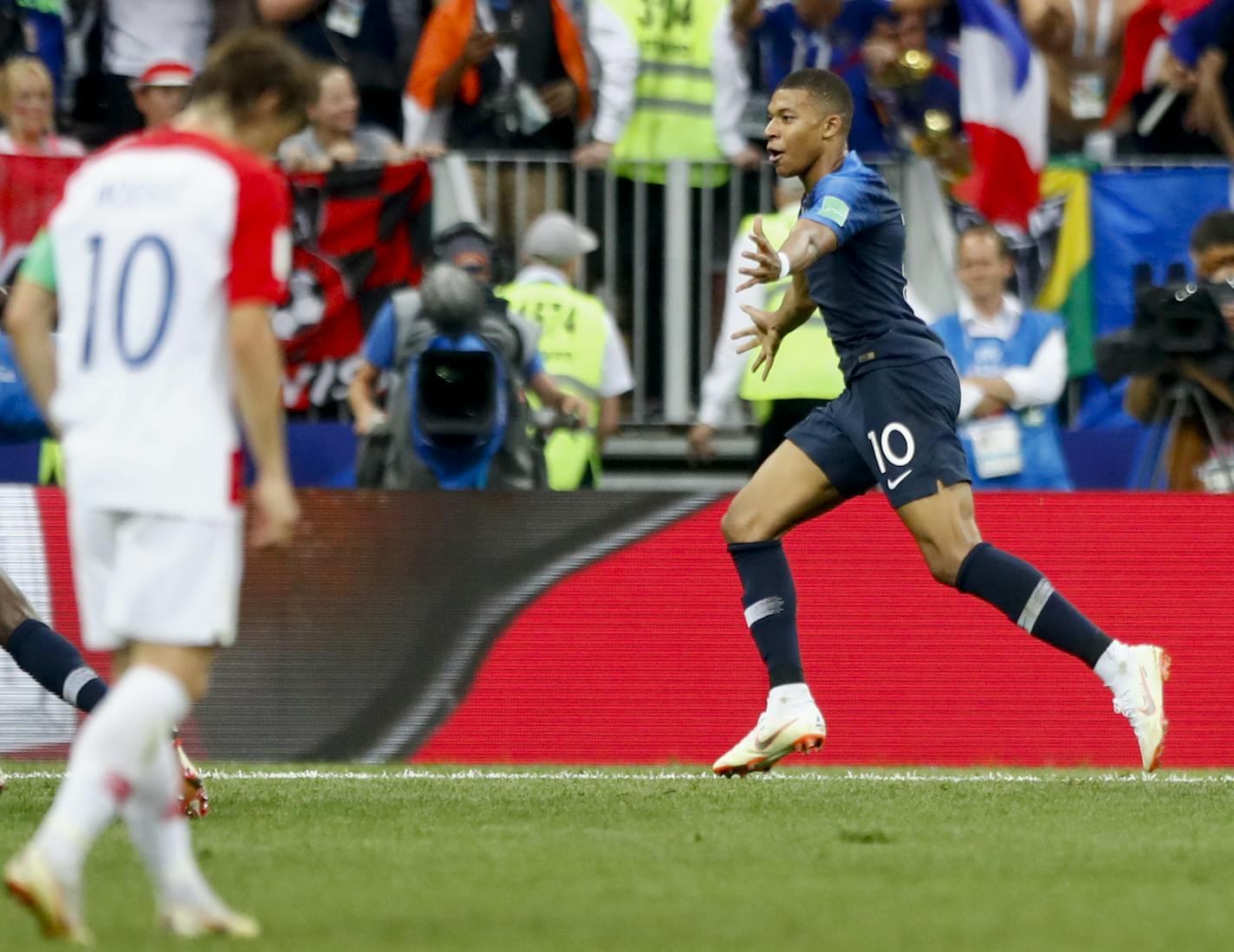 France's Kylian Mbappe celebrates after scoring his side's fourth goal during the final match between France and Croatia at the 2018 soccer World Cup in the Luzhniki Stadium in Moscow, Russia, Sunday, July 15, 2018. (AP Photo/Matthias Schrader)