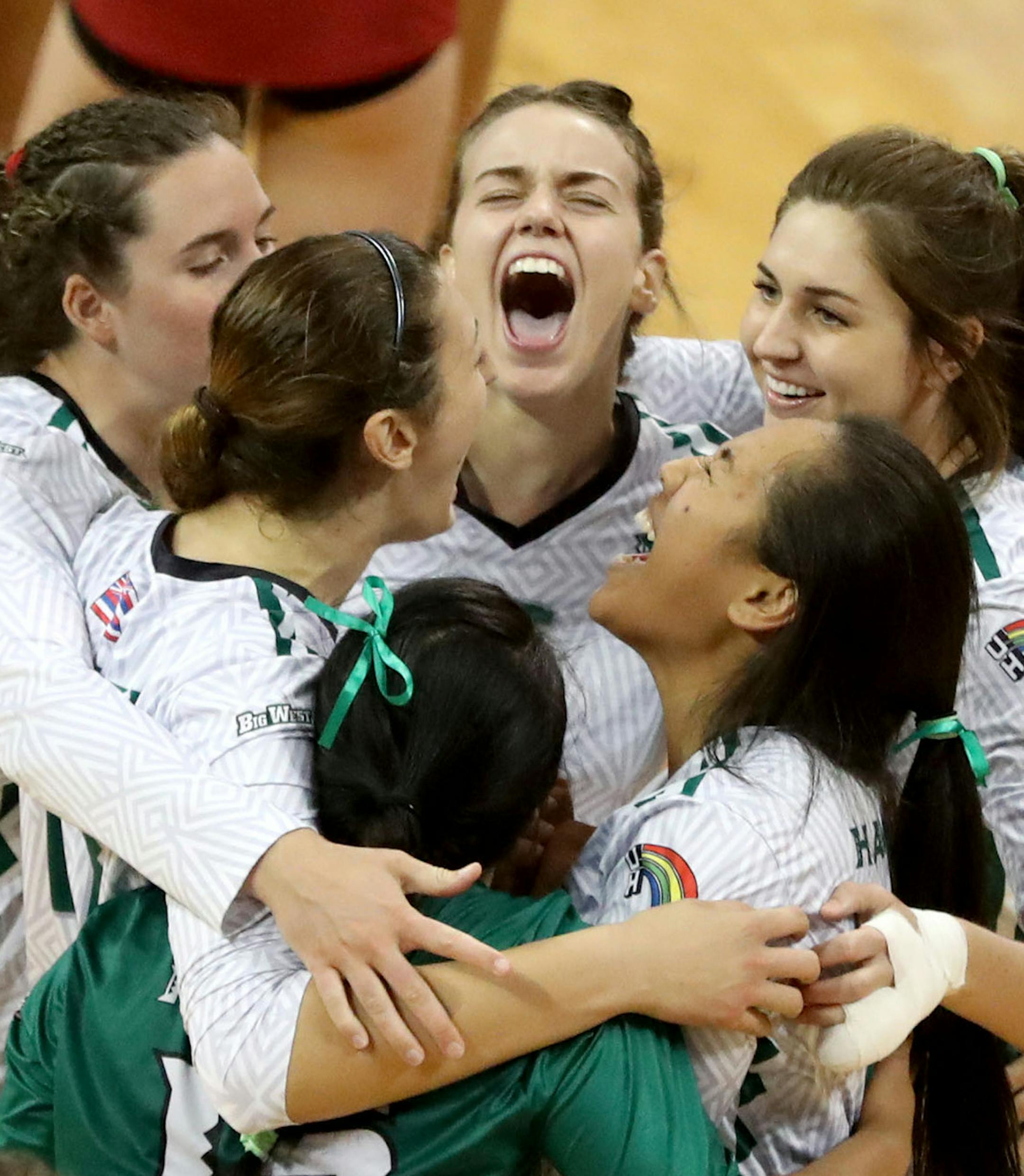 Hawaii, foreground, celebrates it's 3-2 win over USC in the first round of the NCAA volleyball tournament at the Sports Pavilion on the University of Minnesota campus Friday, Dec. 2, 2016, in Minneapolis, MN.] (DAVID JOLES/STARTRIBUNE)djoles@startribune.com NCAA volleyball tournament coverage