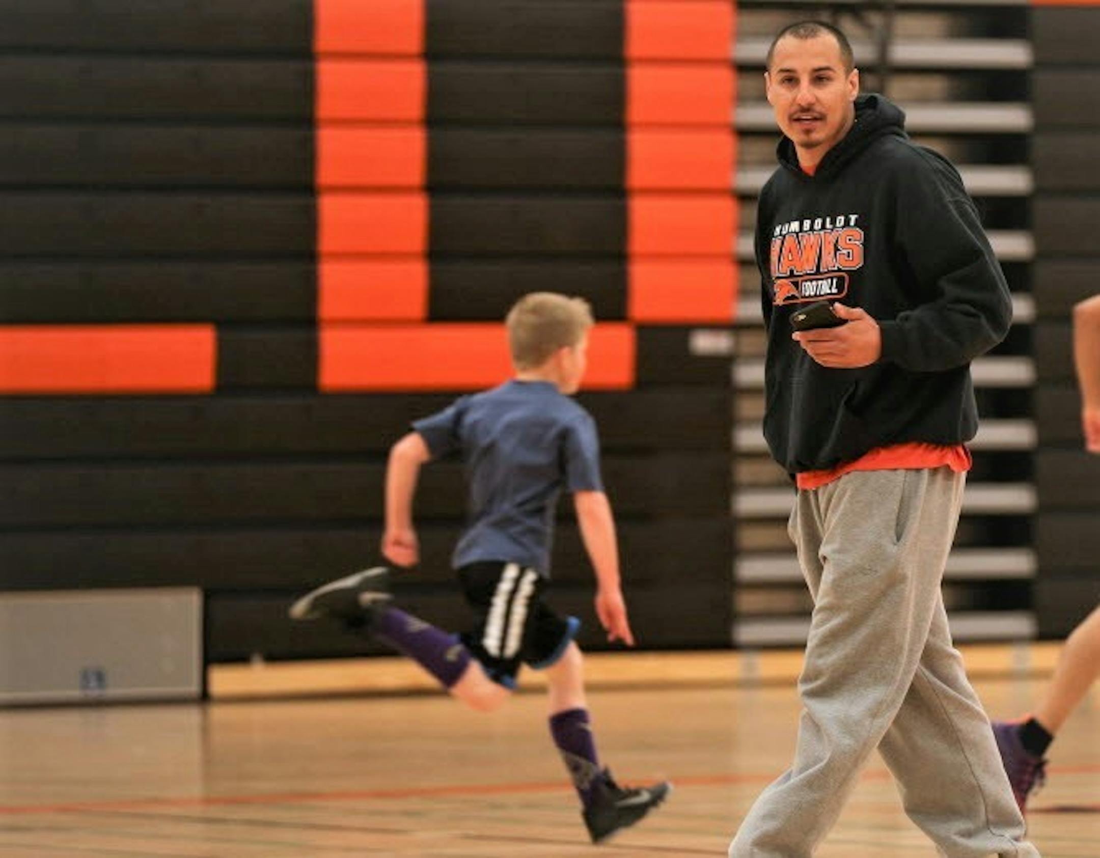 First-year football coach Arnulfo Flores is a key figure in the effort to revitalize varsity sports at Humboldt High School in St. Paul, his alma mater. He led a basketball practice for young kids in the high school gym. ] JEFF WHEELER � jeff.wheeler@startribune.com First-year football coach Arnulfo Flores is a key figure in the effort to revitalize varsity sports at Humboldt. He is among the coaches hired from the community in an effort to stem the decline in participation. He was photographed