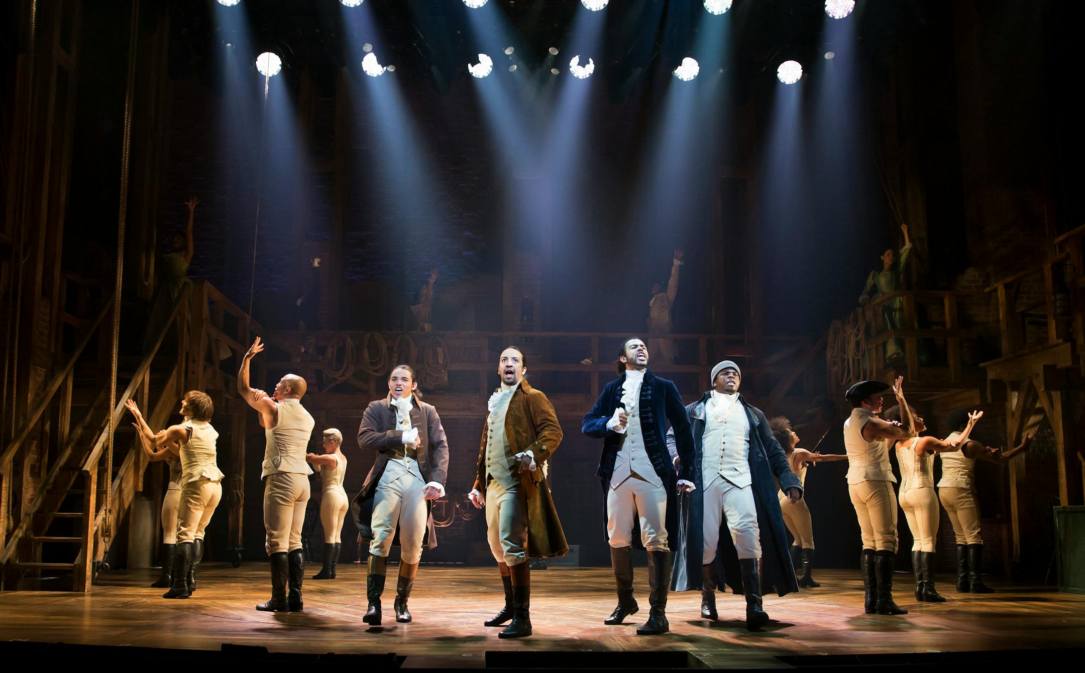 Lin-Manuel Miranda, center, and the cast of �Hamilton,� at the Richard Rodgers Theater in New York, July 11, 2015. Now on Broadway after an worshipfully-received staging at the Public Theater, this show about the founding fathers is making its own resonant history by changing the language of musicals. From left: Anthony Ramos, Miranda, Daveed Diggs and Okieriete Onaodowan. (Sara Krulwich/The New York Times) ORG XMIT: XNYT20