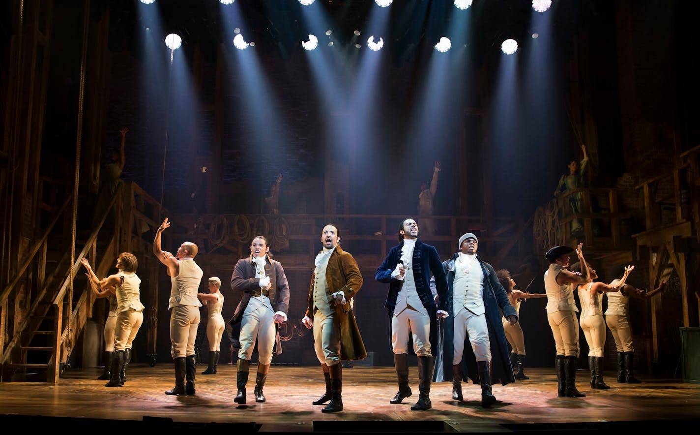 Lin-Manuel Miranda, center, and the cast of �Hamilton,� at the Richard Rodgers Theater in New York, July 11, 2015. Now on Broadway after an worshipfully-received staging at the Public Theater, this show about the founding fathers is making its own resonant history by changing the language of musicals. From left: Anthony Ramos, Miranda, Daveed Diggs and Okieriete Onaodowan. (Sara Krulwich/The New York Times) ORG XMIT: XNYT20