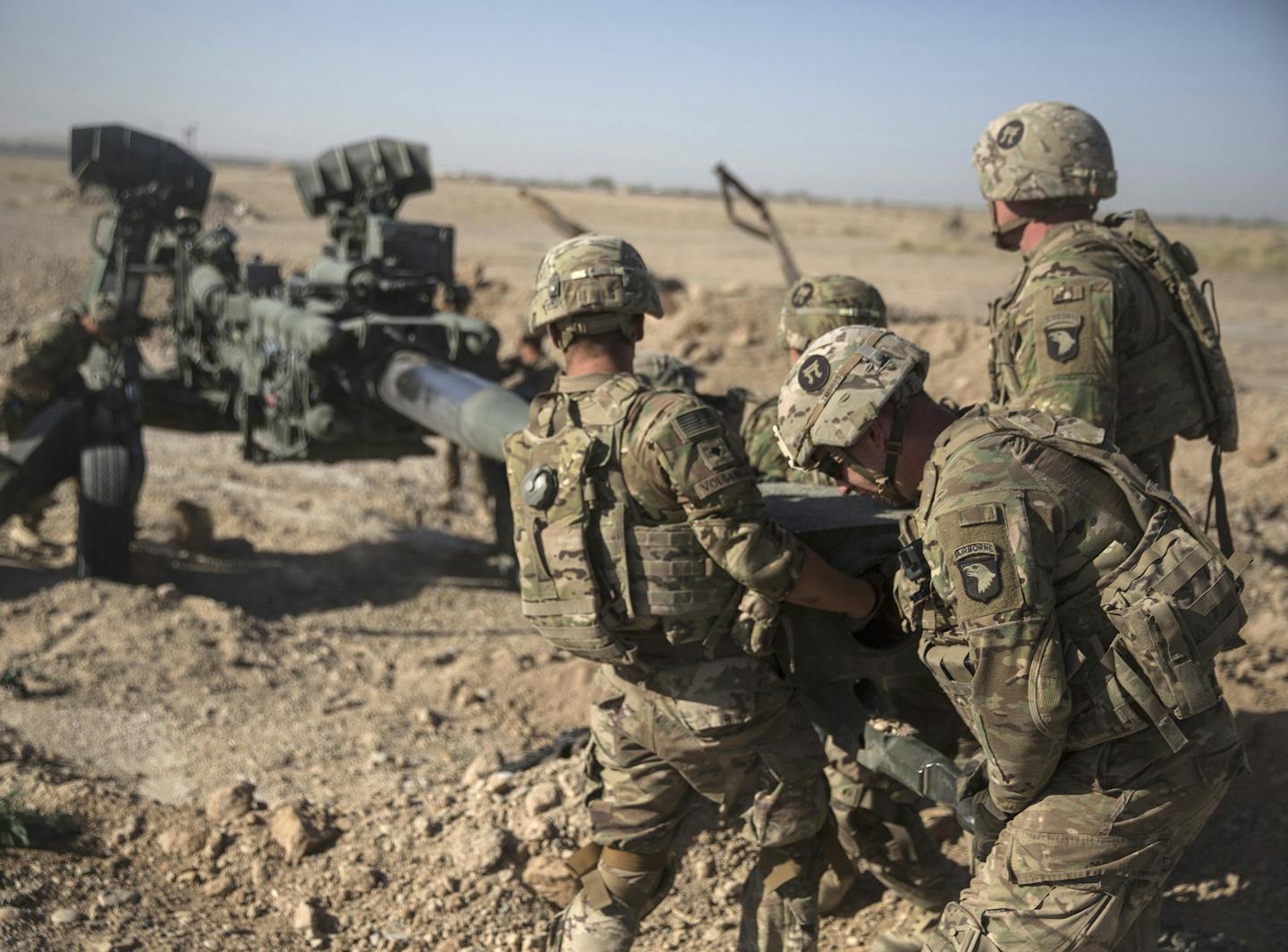 This June 10, 2017 photo provided by Operation Resolute Support, U.S. Soldiers with Task Force Iron maneuver an M-777 howitzer, so it can be towed into position at Bost Airfield, Afghanistan. Sixteen years into its longest war, the United States is sending another 4,000 troops to Afghanistan in an attempt to turn around a conflict characterized by some of the worst violence since the Taliban were ousted in 2001. They are also facing the emergence of an Islamic State group affiliate and an embold