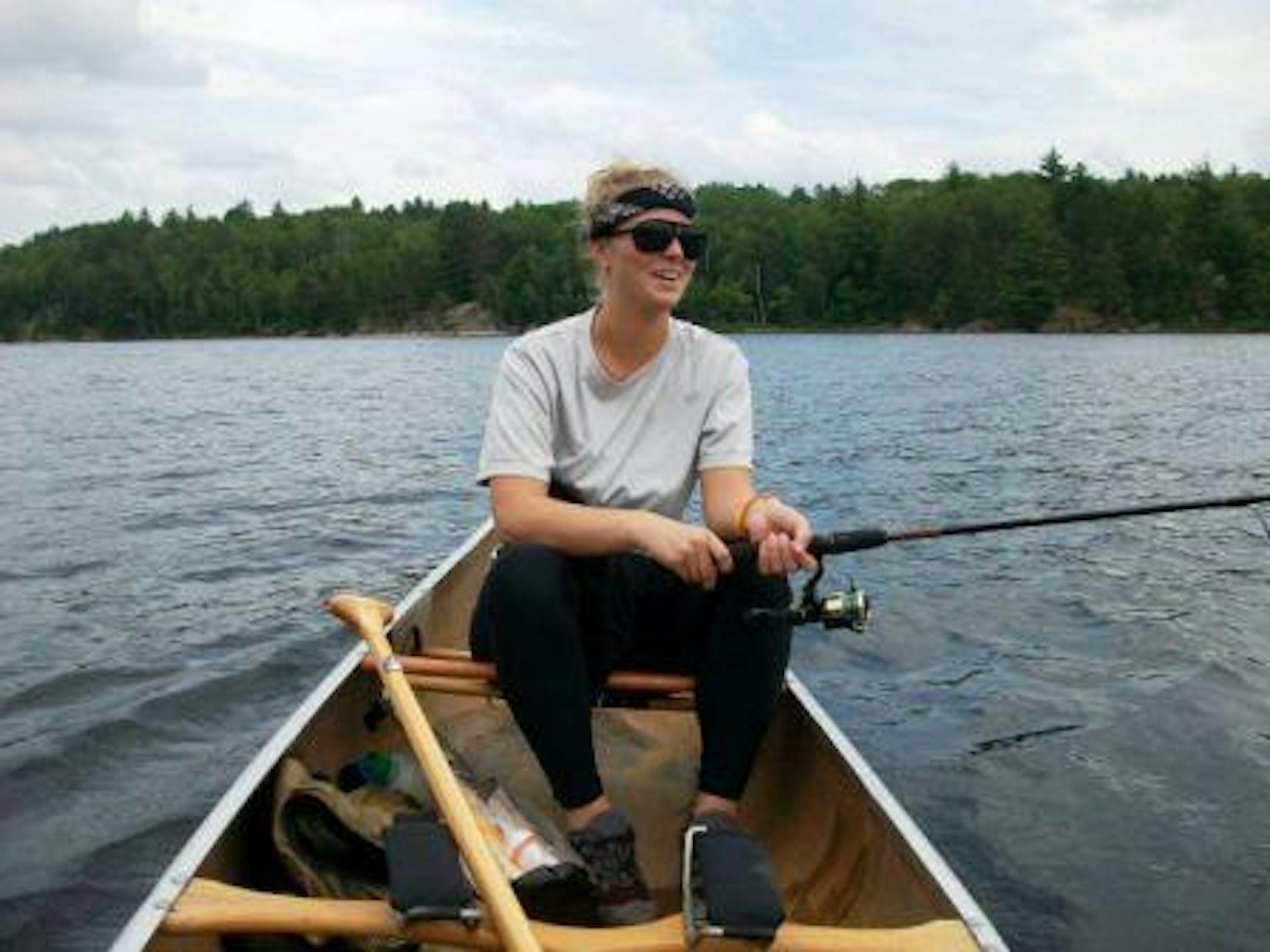 Rachel Schabert taking a break from catching smallies (and embarrassing her guide) in the BWCA
