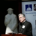 Catholic Archbishop John Nienstedt served as the host during a panel discussion Wednesday about federal immigration reform at the University of St. Th