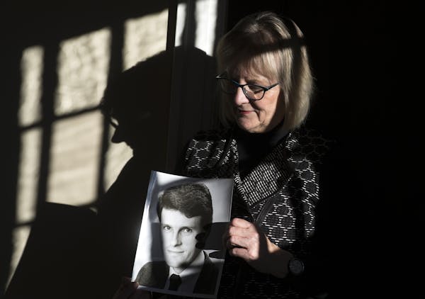 Patty Paulus holds a portrait of her late husband, Stephen Paulus, in his former office on Friday afternoon. ] (Aaron Lavinsky | StarTribune) A look a