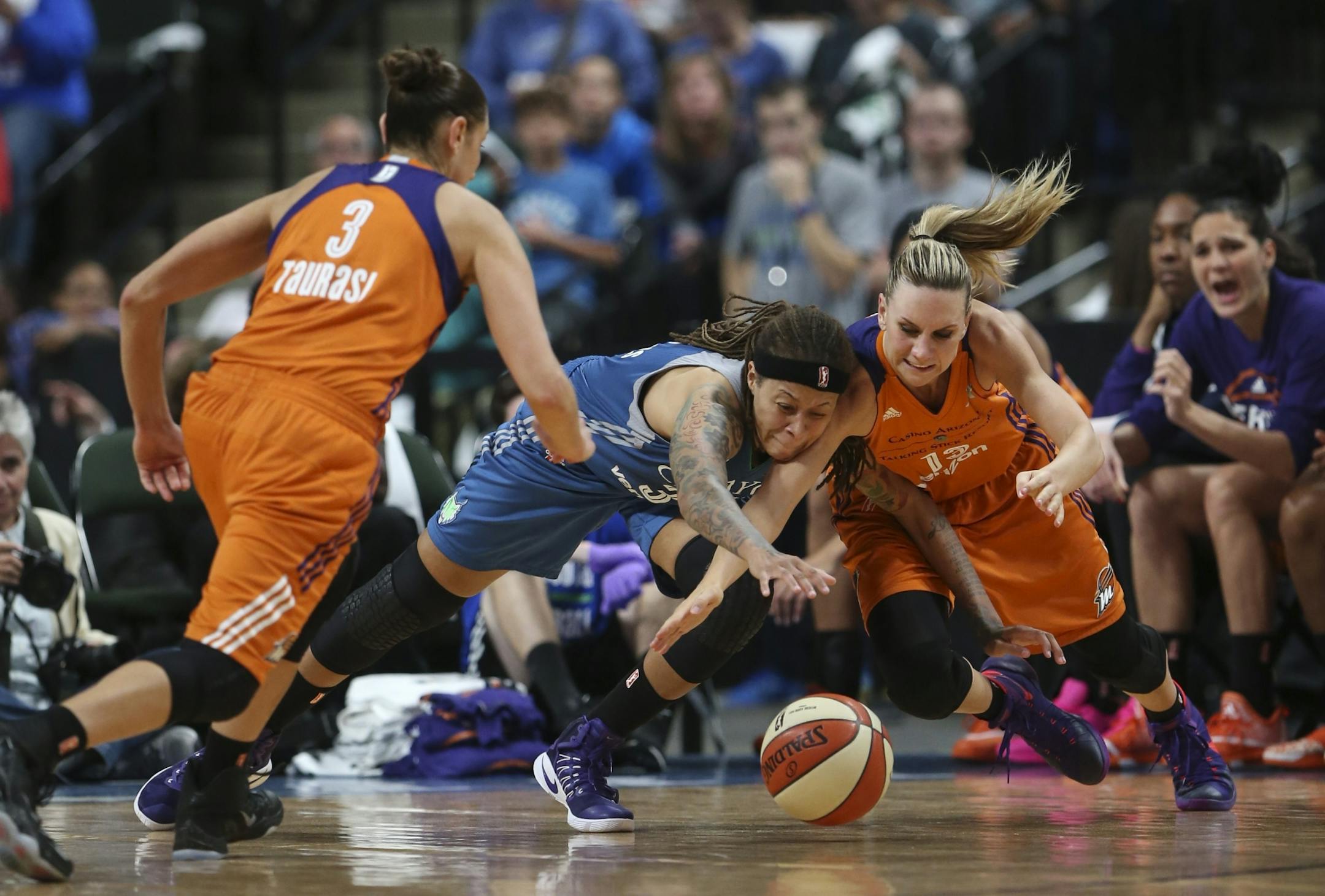Minnesota Lynx guard Seimone Augustus (33) and Phoenix Mercury forward Penny Taylor (13) dove for a ball late in the fourth quarter.