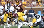 Gophers running back Cam Wiley was tackled by Georgia Southern linebacker Randy Wade Jr. in the first quarter.