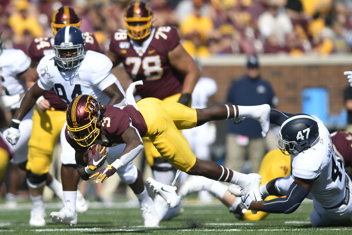 Gophers running back Cam Wiley was tackled by Georgia Southern linebacker Randy Wade Jr. in the first quarter.