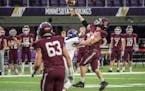 Chatfield's Sam Backer (21) passes the ball during a Class AA State Football Semifinal game against Barnesville Thursday, Nov. 18, 2021, at U.S. Bank 