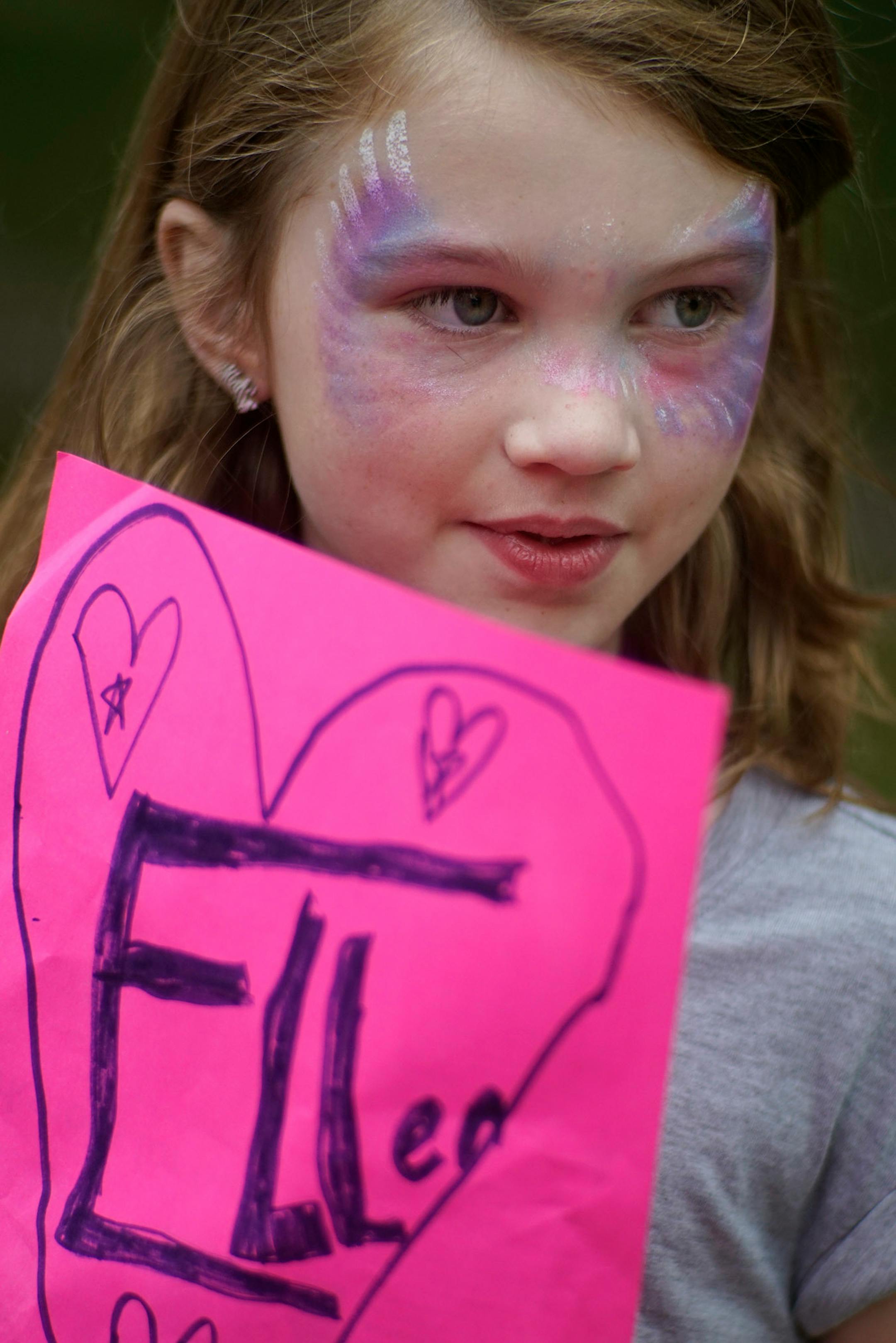 Brown Hunter,8, had a sign ready for her aunt Ellen.