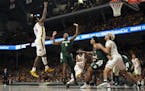 Minnesota Golden Gophers guard Marcus Carr (5) shot over Michigan State Spartans guard Cassius Winston (5) in the first half. Carr finished with 11 po