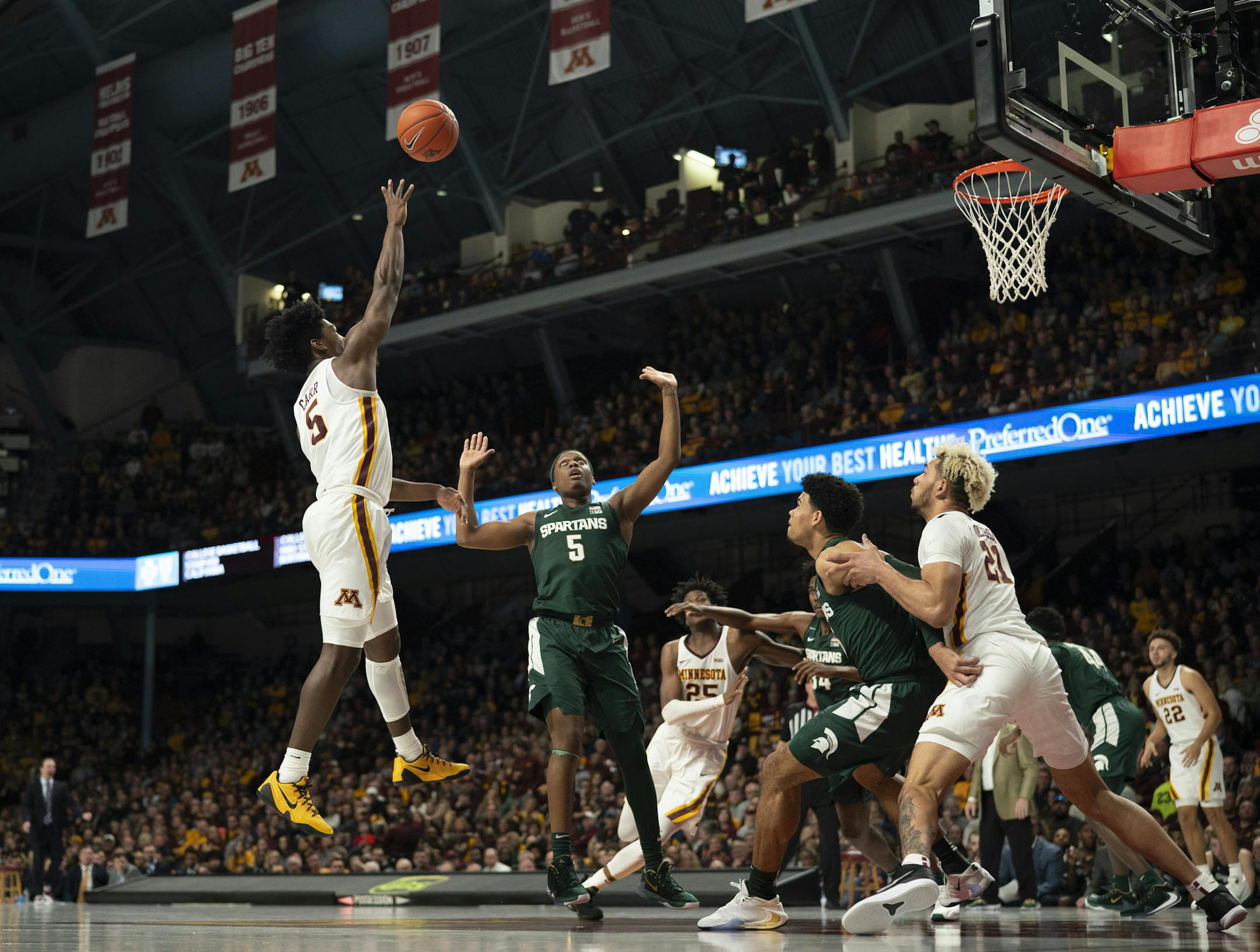 Minnesota Golden Gophers guard Marcus Carr (5) shot over Michigan State Spartans guard Cassius Winston (5) in the first half. Carr finished with 11 points. ] JEFF WHEELER • Jeff.Wheeler@startribune.com The University of Minnesota men's basketball team faced the Michigan State Spartans in an NCAA basketball game Sunday afternoon, January 26, 2020 at Williams Arena in Minneapolis.
