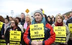 Protesters stage an anti brexit rally on the Old Dublin Road, in Carrickcarnon, Ireland, Saturday, March 30, 2019. Border communities protested agains