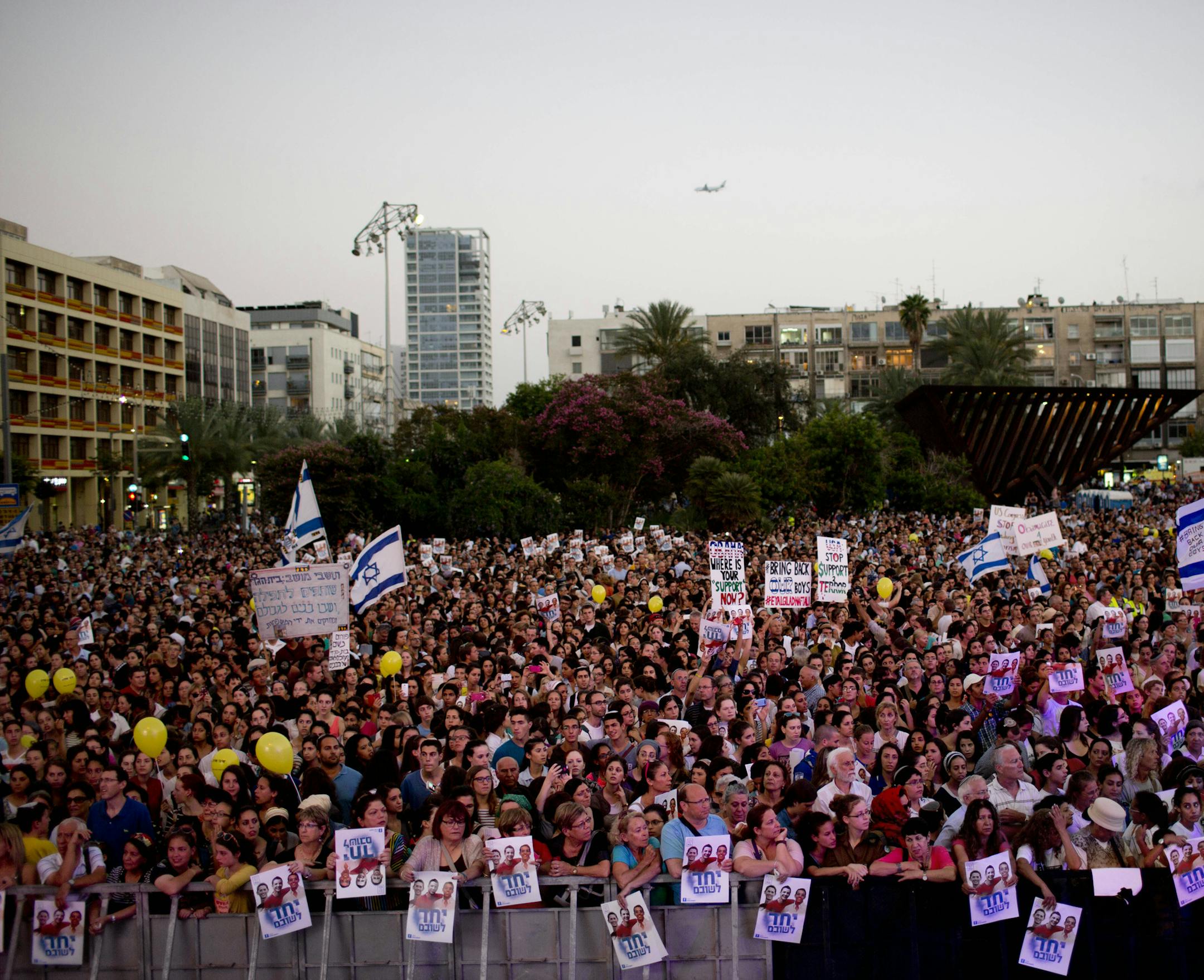 Thousands of Israelis gather for a rally calling for the release of the three missing Israeli teens, feared abducted in the West Bank on June 12, in Tel Aviv, Israel, Sunday, June 29, 2014. There has been an increase in rockets launched from the Hamas-ruled territory toward Israel this month, as the army has carried out a wide-ranging operation against Hamas in the West Bank while searching for three Israeli teens who Israel says were abducted by the Palestinian militant group. (AP Photo/Oded Ba