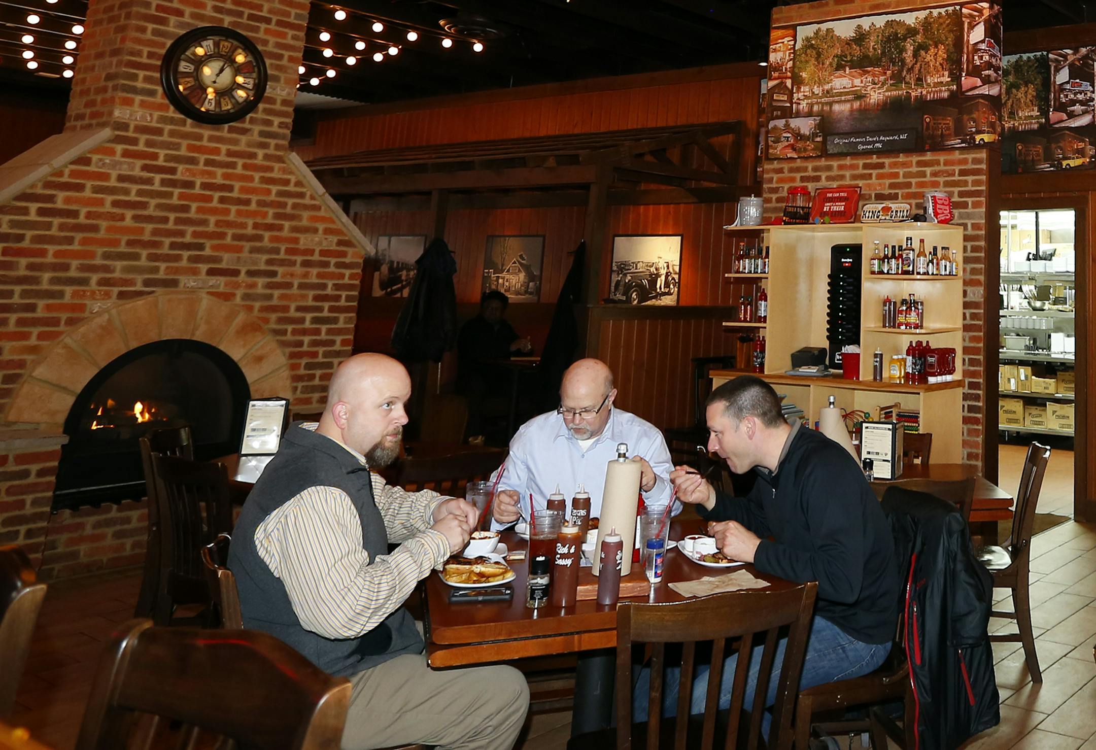 Customers sit in the newly remodeled Famous Dave's Legendary Pit Bar-B-Que restaurant on Wednesday, March 4, 2015, in Bolingbrook, Illinois, (AP Photo/Jeff Haynes) ORG XMIT: ILJH110