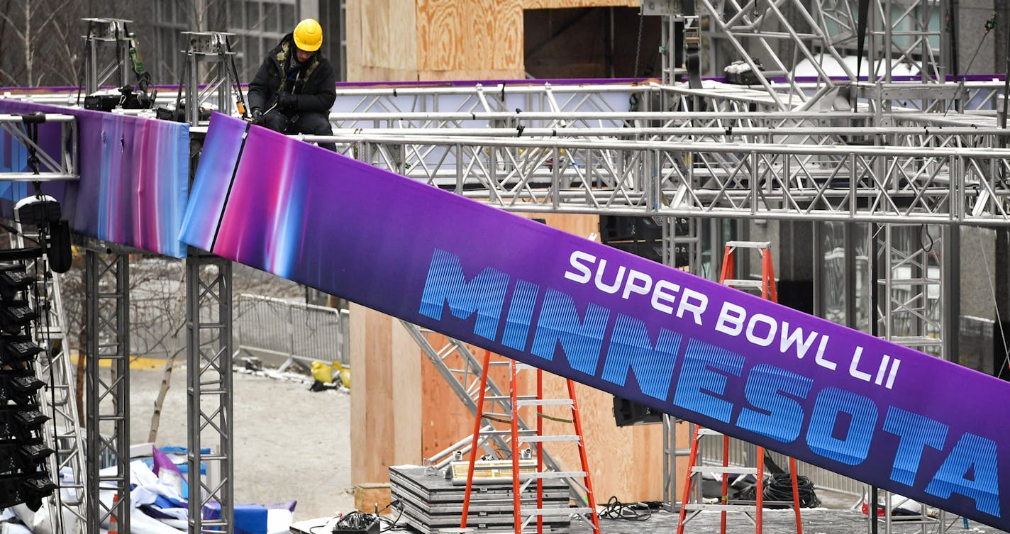 Super Bowl banners came down from the main stage. ] GLEN STUBBE &#x2022; glen.stubbe@startribune.com Monday, February 5, 2018 SuperBowl 52 is in our rearview mirrors and someone has to clean up the mess. Crews began clearing Nicollet Mall early Monday, pulling down banners, removing barricades and dismantling the stage.