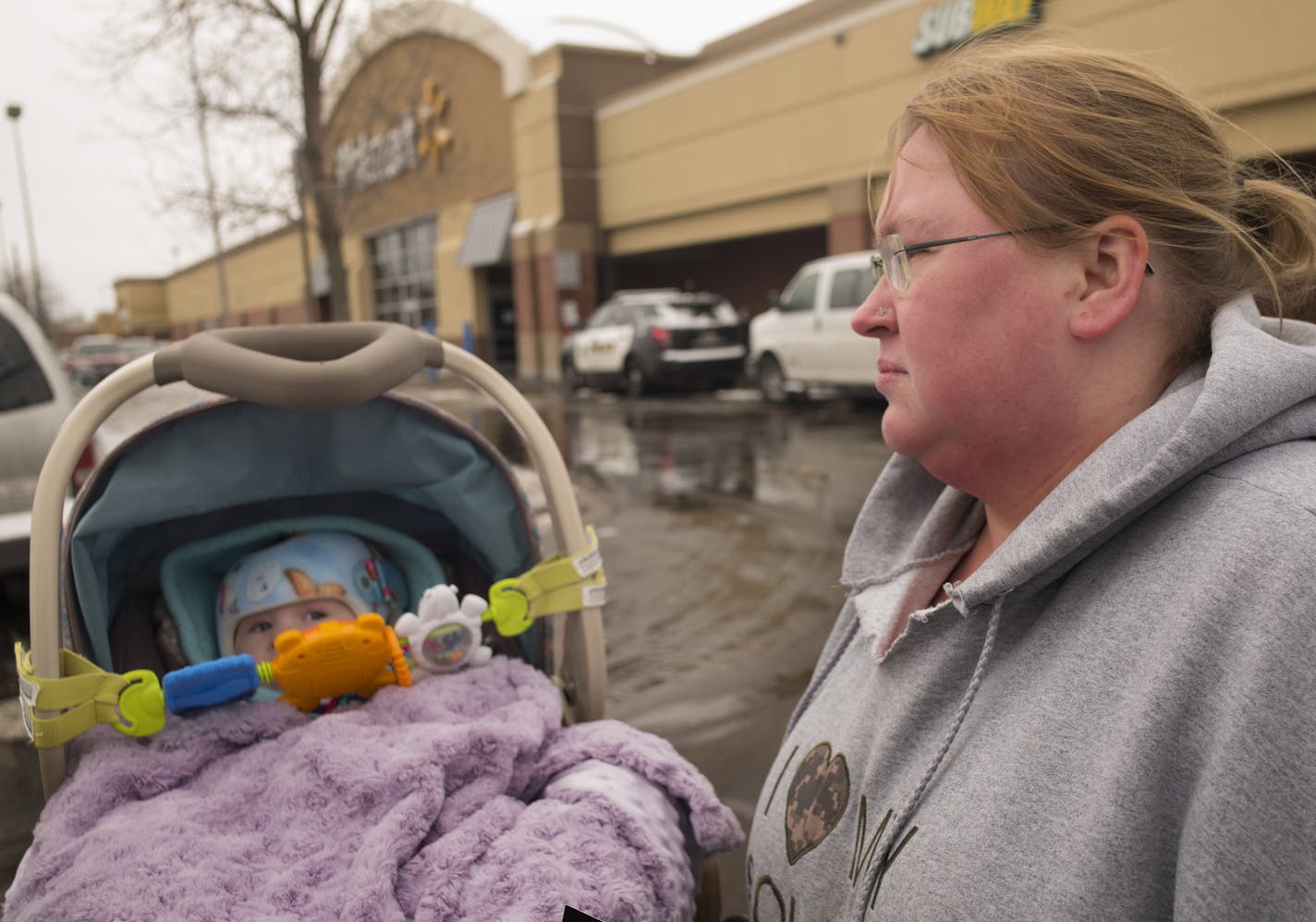 At the Walmart near the intersection of Snelling and University in St. Paul, protesters including Walmart cashier Lisa Austin is on strike because she was scheduled to work beyond the hours she had made clear she was available. She does not have childcare. ] Richard Tsong-Taatarii/ rtsong- taatarii@startribune.com