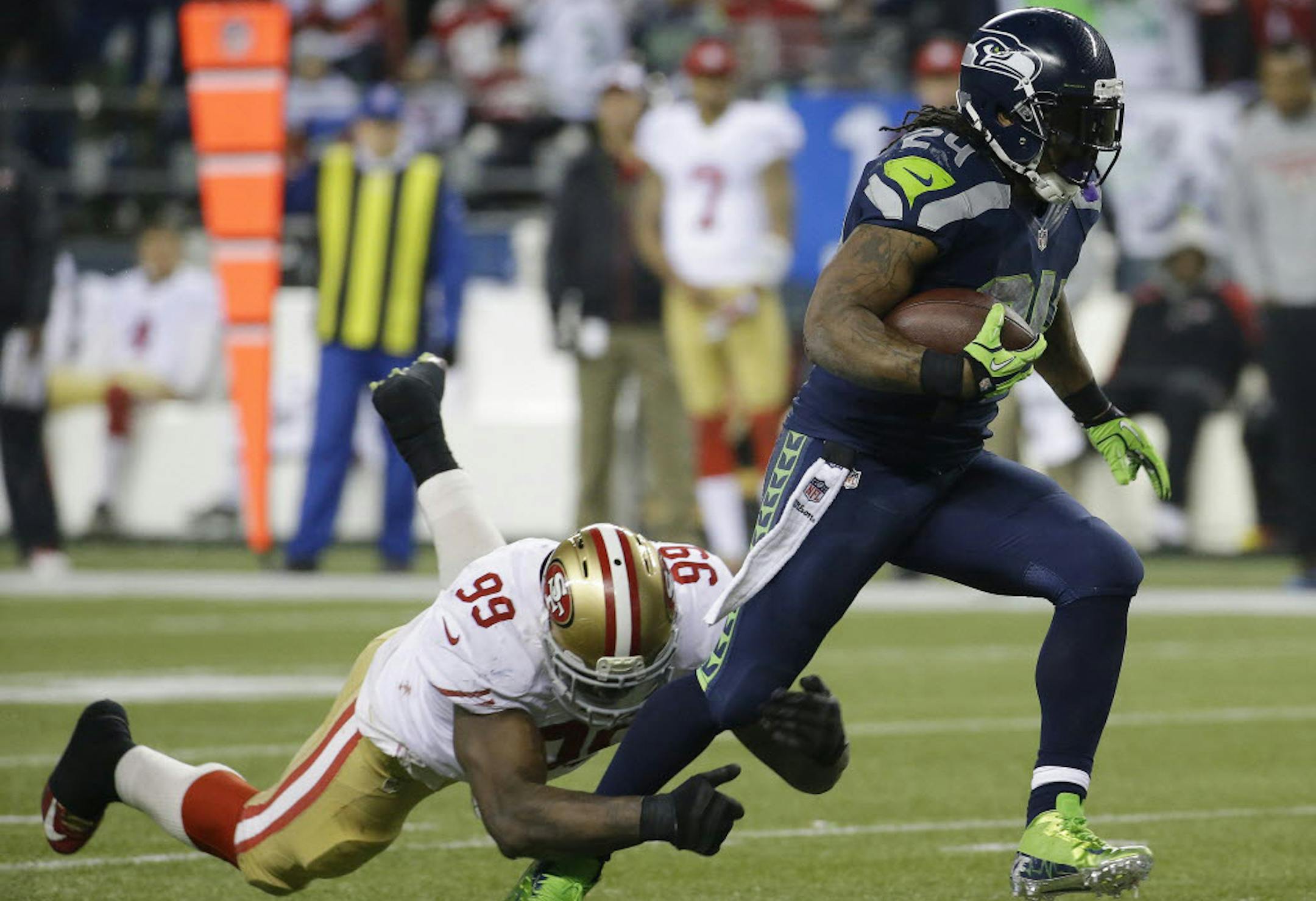Seahawks running back Marshawn Lynch's holdout is over, ending one distraction so far for the Super Bowl champions.