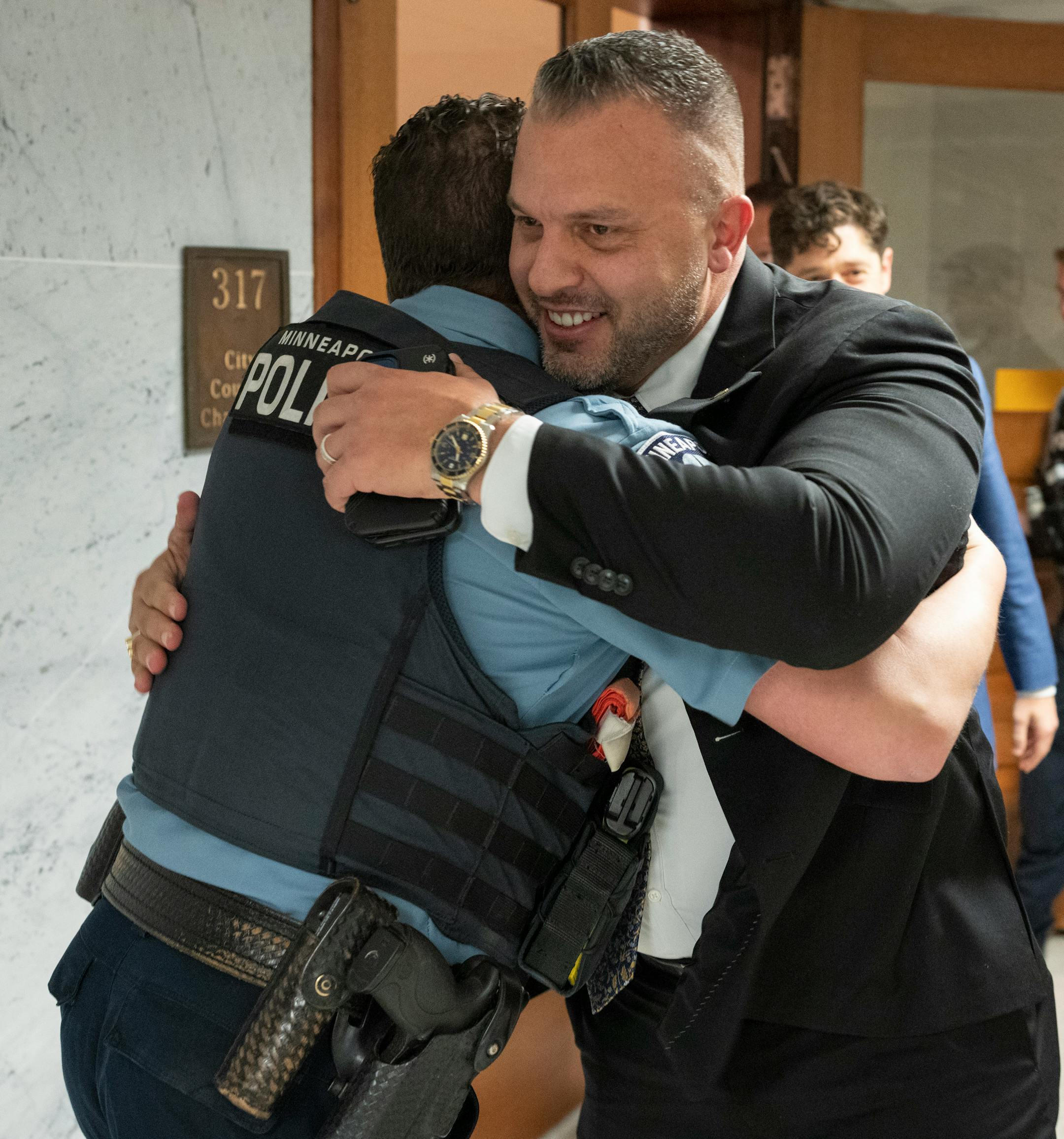 Brian O'Hara, right, was congratulated after he was voted in as the new Minneapolis police chief.