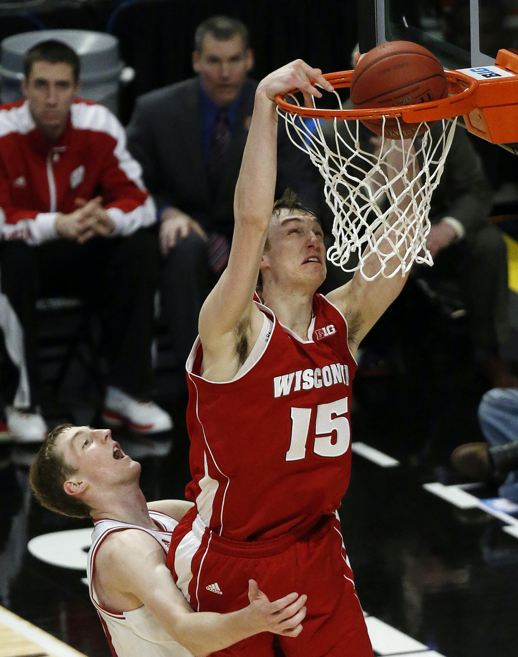 Wisconsin's Sam Dekker (15) dunks over Indiana's Cody Zeller during the second half of an NCAA college basketball game at the Big Ten tournament Saturday, March 16, 2013, in Chicago. Wisconsin won 68-56. (AP Photo/Charles Rex Arbogast)