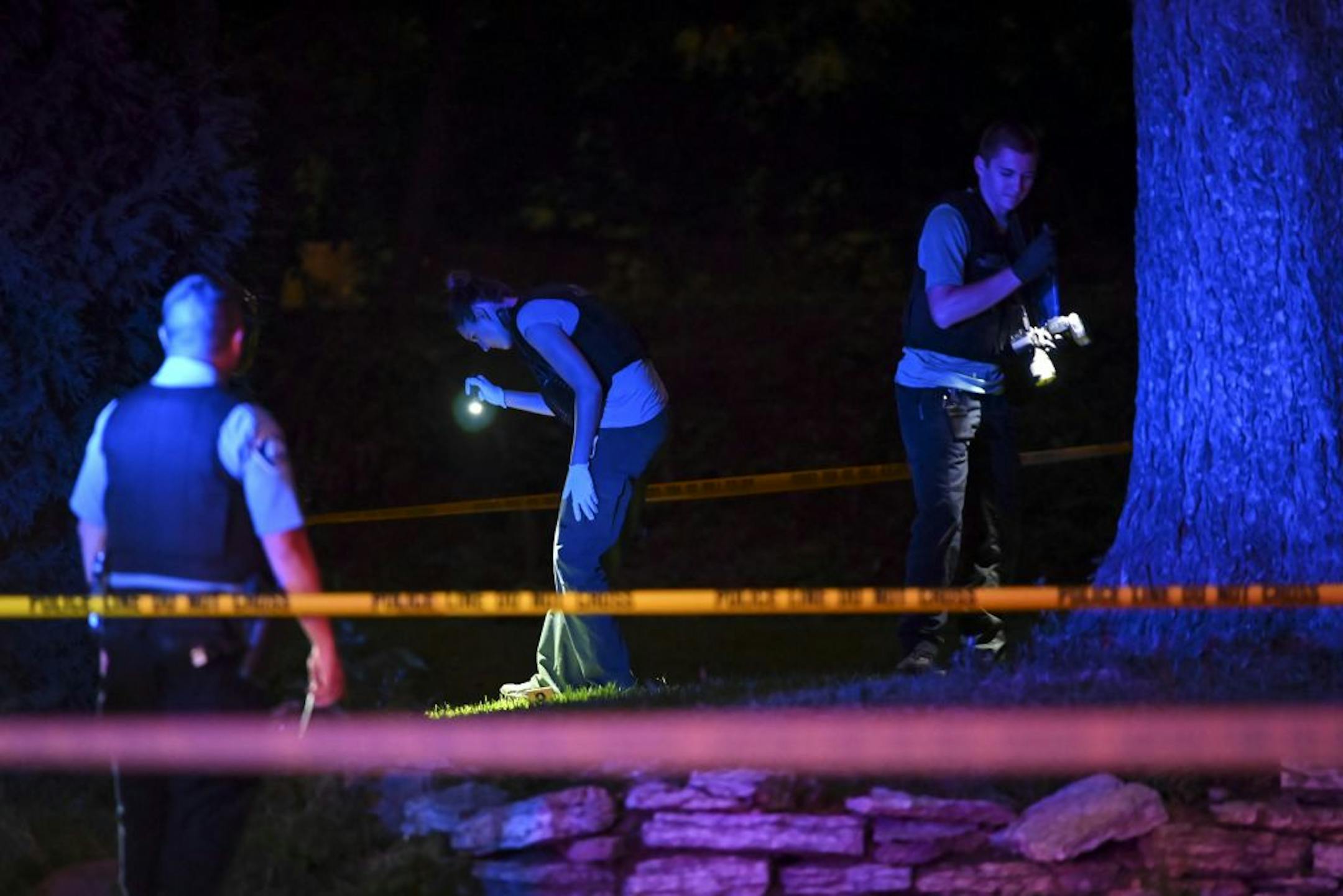 The Minneapolis Police Crime Lab Unit investigated the scene of Friday night's shooting in north Minneapolis, in which multiple people were reported shot.