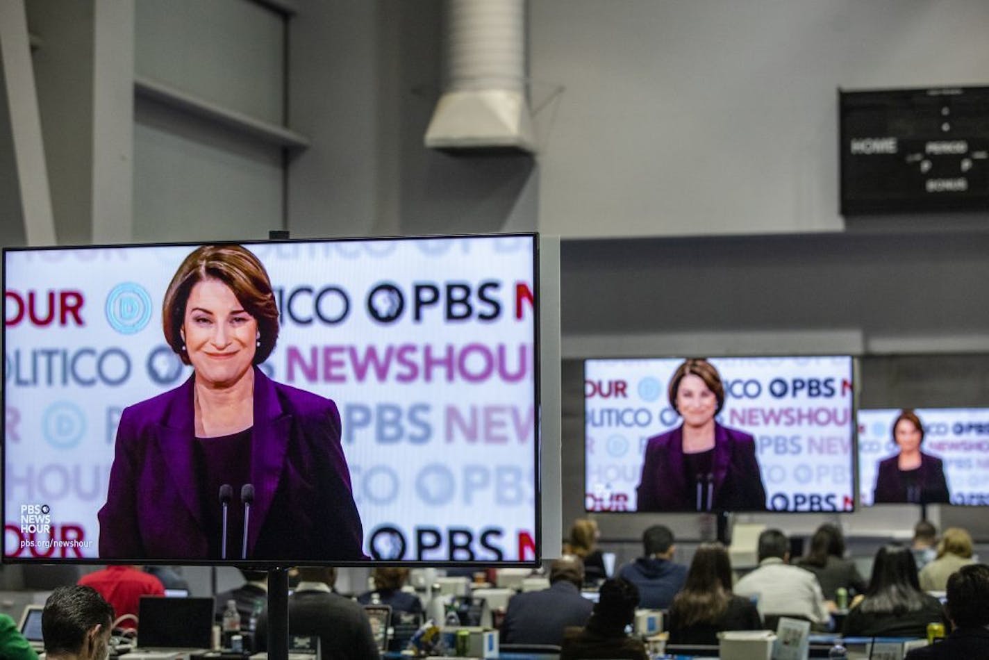 Screens show Sen. Amy Klobuchar (D-Minn.) during the Democratic presidential debate co-hosted by PBS and Politico at Loyola Marymount University in Los Angeles, on Thursday, Dec. 19, 2019.