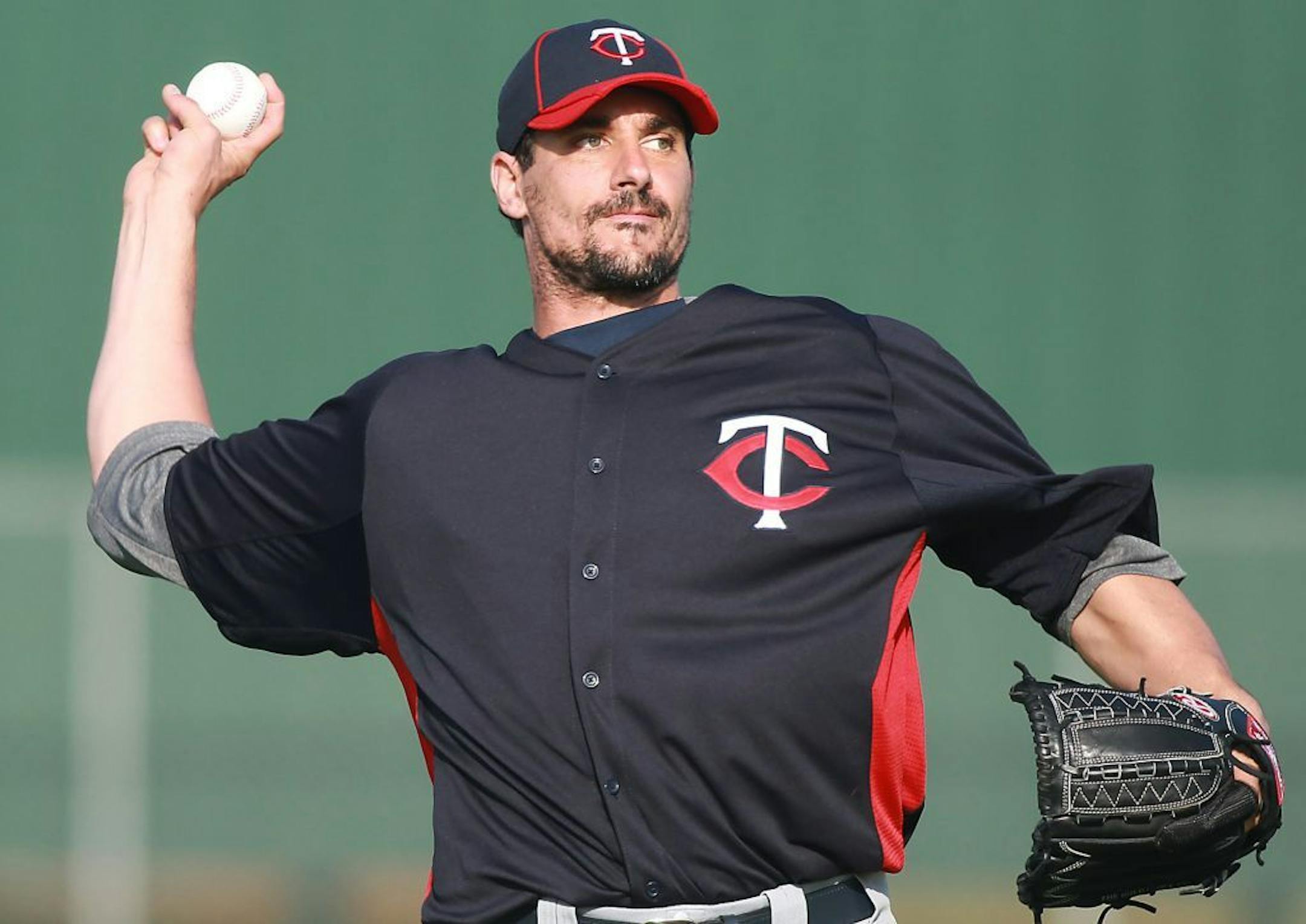 Right hand pitcher Carl Pavano warmed up his arm at Hammond Stadium during spring training with the Twins in 2012.