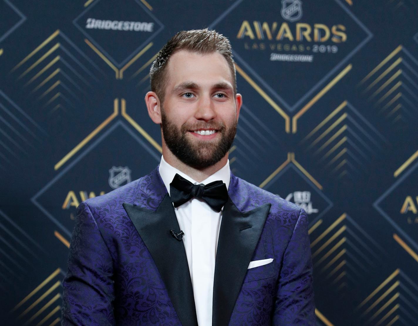 Jason Zucker of the Minnesota Wild poses on the red carpet before the NHL Awards, Wednesday, June 19, 2019, in Las Vegas. (AP Photo/John Locher)