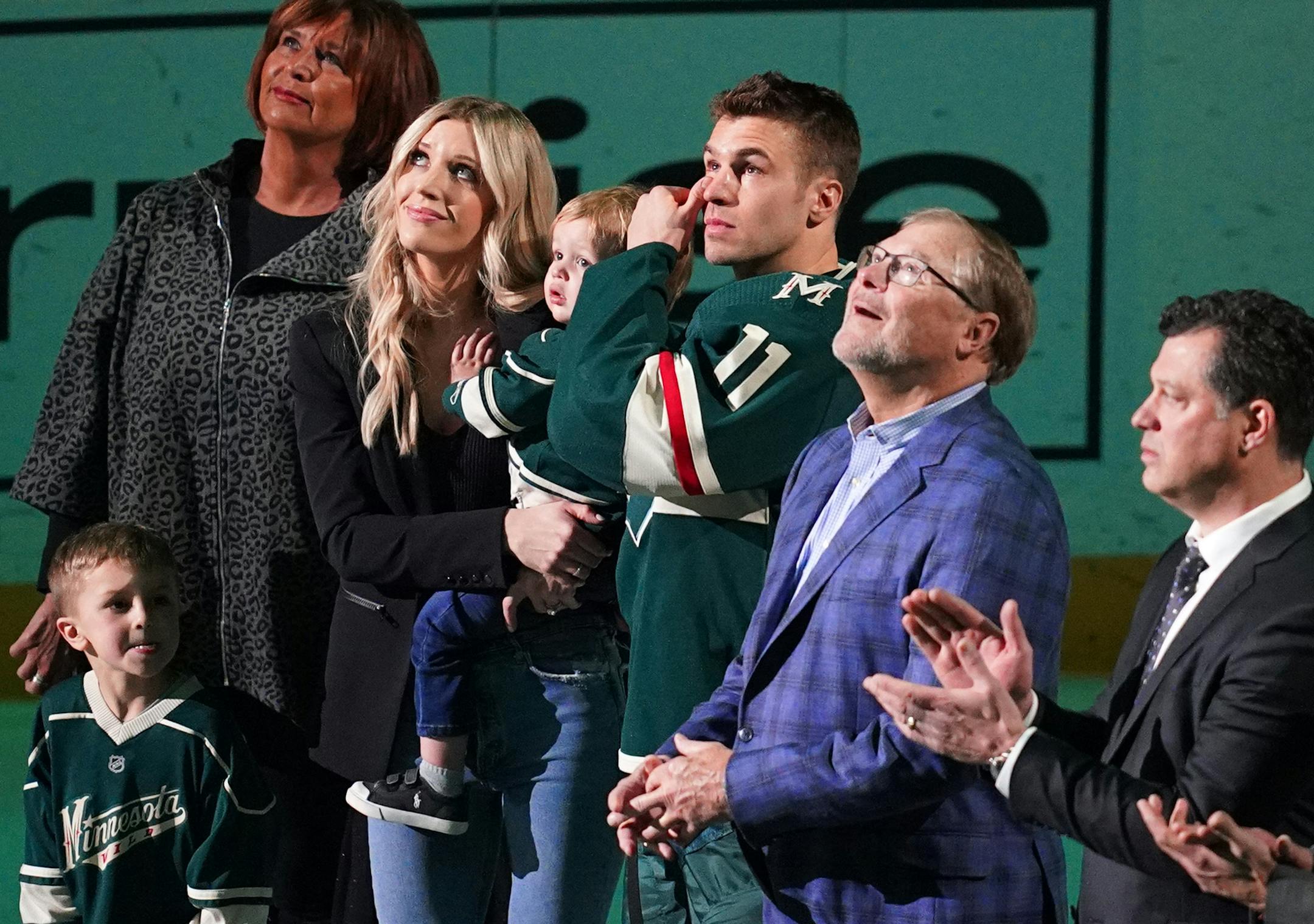 Minnesota Wild left wing Zach Parise (11) wiped away tears as he stood on the ice with his family while they watched a video tribute to his 1000th game played before the start of the first period. ] ANTHONY SOUFFLE • anthony.souffle@startribune.com The Minnesota Wild played the San Jose Sharks Saturday, Feb. 15, 2020 at the Xcel Energy Center in St. Paul, Minn.