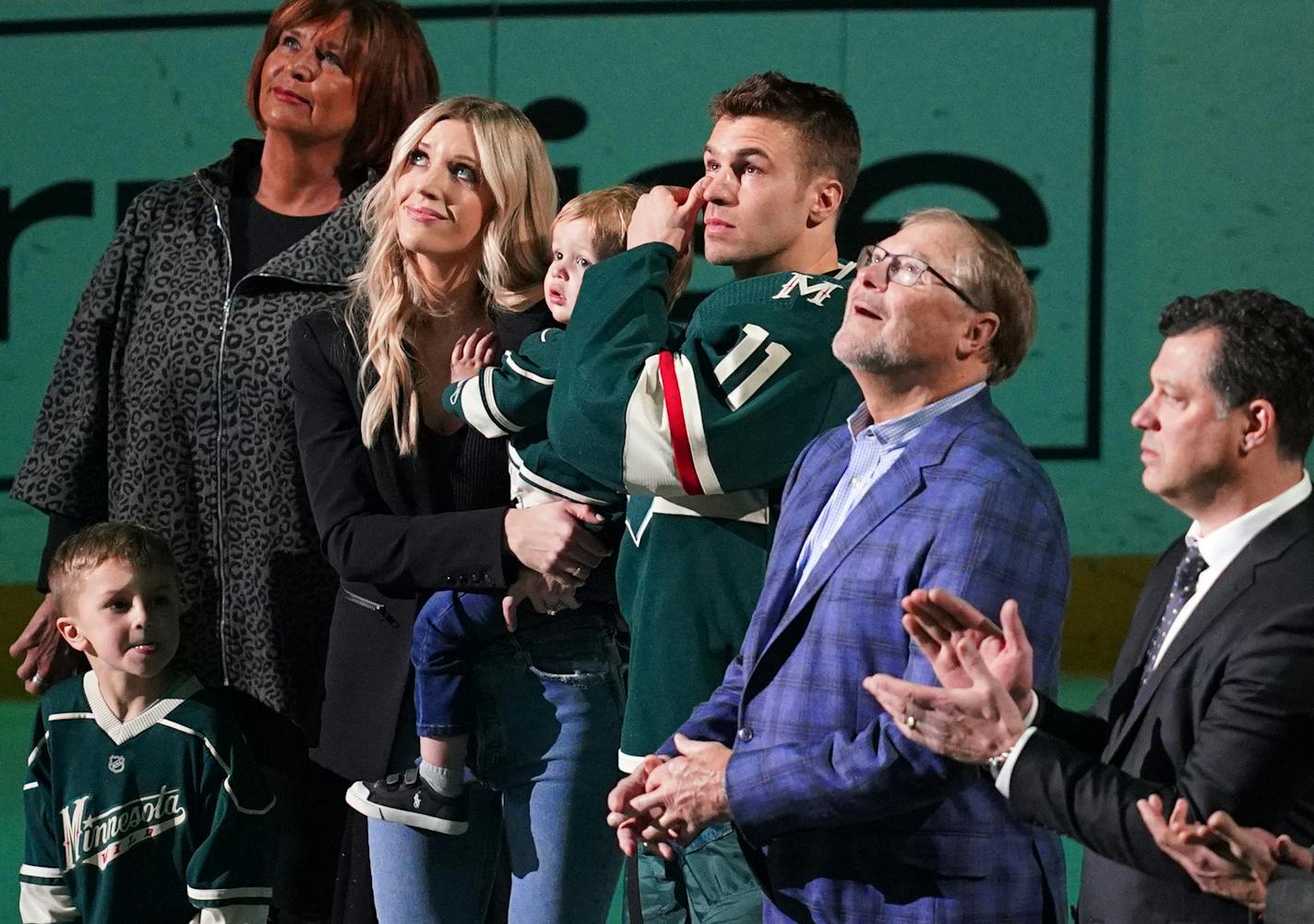 Minnesota Wild left wing Zach Parise (11) wiped away tears as he stood on the ice with his family while they watched a video tribute to his 1000th game played before the start of the first period. ] ANTHONY SOUFFLE &#x2022; anthony.souffle@startribune.com The Minnesota Wild played the San Jose Sharks Saturday, Feb. 15, 2020 at the Xcel Energy Center in St. Paul, Minn.