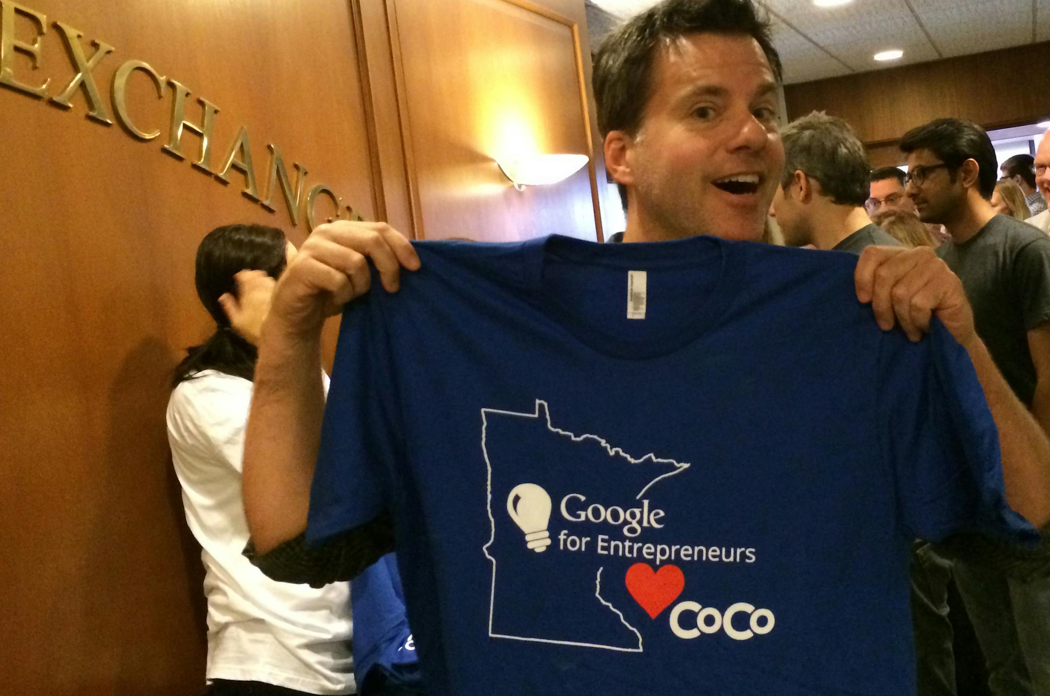 Kevin Quinlan, who runs his one-man marketing firm from the workspace firm CoCo in downtown Minneapolis, got a free t-shirt as part of the Google-CoCo financial and technological partnership announced Wednesday. Photo: Steve Alexander/Star Tribune 09/25/2013