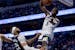 Anthony Edwards of the Timberwolves dunks the ball over Mavericks forward Daniel Gafford in the third quarter of Game 3 of the NBA Western Conference 